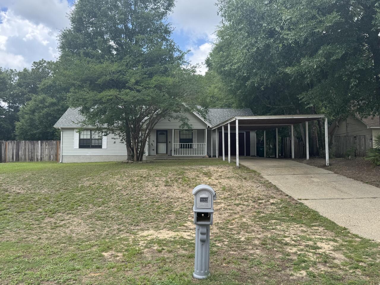 Located SOUTH OF I-10! This 3 bedroom 1.5 bath home on a 0.39 acre lot has a 2022 three dimensional shingle roof, a 2022 AC and gas furnace, 2023 septic system, newer paint, newer LVP flooring, as well as some new ceiling fans and light fixtures. The home offers a spacious living room, large open kitchen with dining area, primary bedroom with large closet and bathroom access. There are two additional bedrooms and a half bathroom located in the hall for guests. Don't miss the HUGE bonus room that could be used for many purposes: office, tv room, recreation room/pool table, indoor gym etc. The large lot offers a spacious front and backyard with mature trees. The backyard has two sheds being sold AS IS, outdoor patio, and fence. The driveway has covered parking for 3 cars.