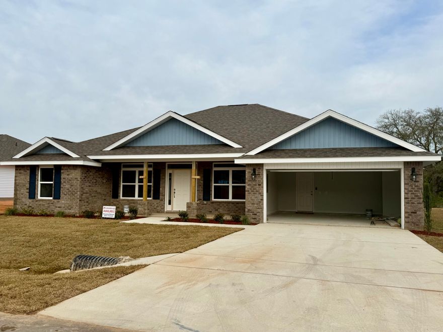 4 bedrooms, 2 full bathrooms, a study, covered lanai, breakfast bar and separate shower in Master bath. The family room ceiling is vaulted and has a beautiful ceiling fan. The master bedroom has a try ceiling with fan. All other rooms are wired and secured for additional fans. Appliances are stainless and include dishwasher, microwave and smooth top range. The master bath has dual vanities and 2 walk in closets. There will be carpet everywhere except for wet areas which will have up-graded flooring. The yard is fully sodded and landscaped, and the front of the home is brick with the other 3 sides having maintenance free vinyl. The sub is well lit with decorative lamp posts.