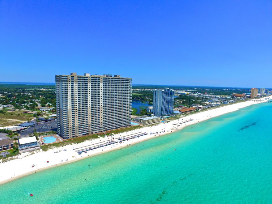 RARE WEST CORNER CONDO ON 10TH FLOOR! 2,248SF OF LIVING SPACE, 3 Beds, 3 full baths plus bunk room! Wraparound Balcony! SUNSET VIEWS! Welcome to Tidewater Beach Resort #1001 in Panama City Beach, Florida. This incredible western corner condo offers THE BEST that Tidewater has to offer and one of the largest condos anywhere in the market. This condo lives large with plenty of room for the entire family or multiple families to spread out and enjoy themselves. The Gulf Front Master bedroom is enormous with a bay window and balcony access as well as a true master bathroom with double vanity, separate shower, tub and walk-in closet. Each guest bedrooom is large in size as well and offers immense versatility in sleeping configurations.