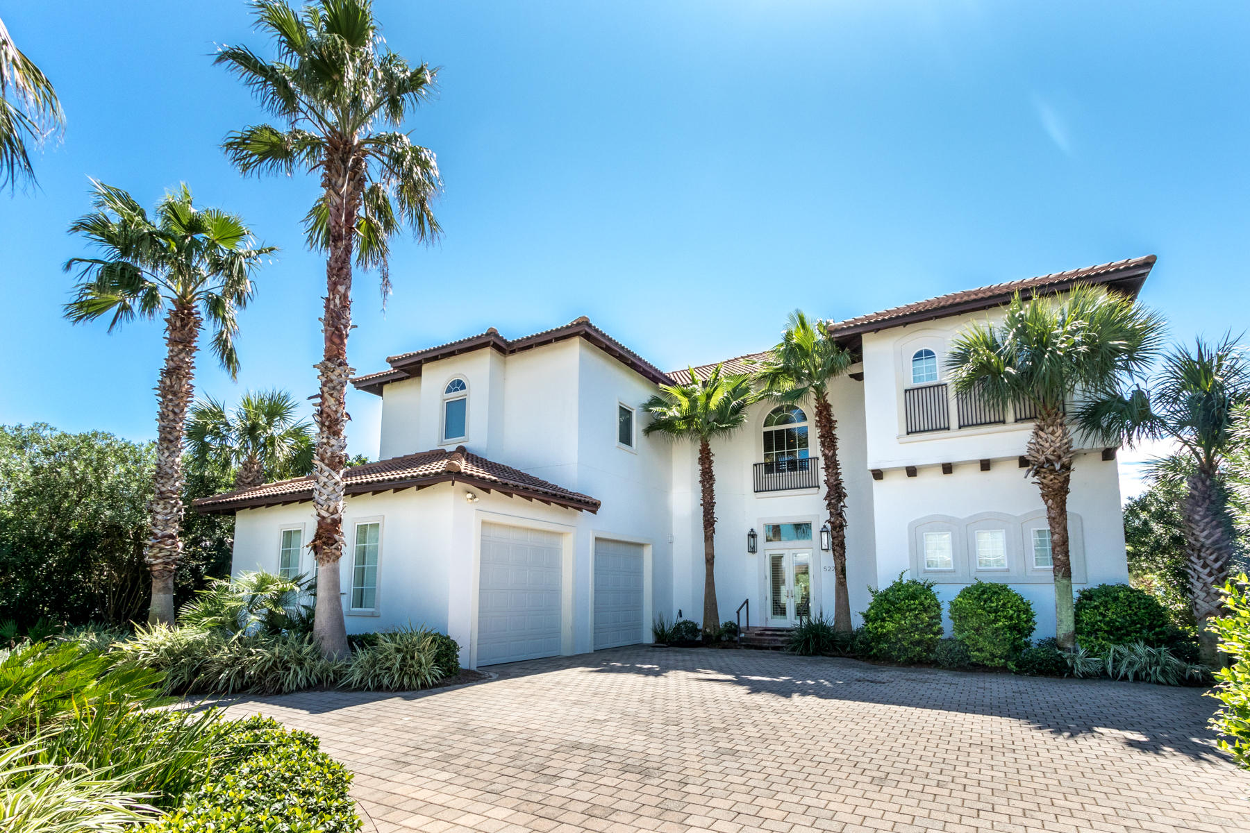 This Holiday Isle charmer embraces 90' of shimmering waterfront. You need not do a thing to improve this immaculate, well-designed home - except show up with a boat or three. The boat slips are 16' X 30' and 20' X 40' with a pull-beside dock. Just one street back from private beach access, vacation renters return year-after-year. 2019 rental income topped $100,000.  Whether poolside at your full-sized water front heated pool/hot-tub or dockside, just minutes from Crab Island revelry, harbor front dining, or deep-sea fishing, life at 522 Vera Cruz is all about sun and sea. A bright white exterior leads to neutral decor, industrial modern touches, and timeless design. Added touches of alluring coastal color, a reliable blend of hardwood and stone flooring, an enviable designer kitchen,