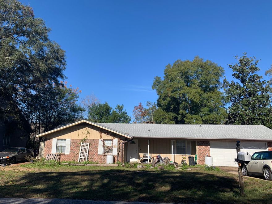 SOLID BRICK Home with backyard FENCED CENTRALLY Located in Niceville. RV Concrete PAD with clean out, oversized car garage, Roof 2018 with GAF Timberline HD, HVAC 2018, serviced 2024, Water Heater 2020, Electrical is copper, plumbing is copper. Rain Gutters installed 2016.  Airduct cleaned in 2018.  Kitchen updated 2007 with laminated countertop with solid oak cabinets.  Microwave built in exhaust.  Little TLC for this house for a perfect starter or Rental Investment with .23 ac lot with Brick Fireplace.