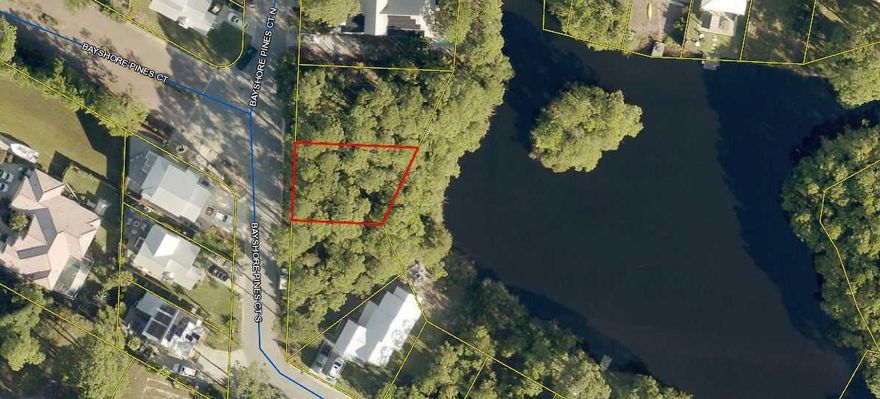 This is a great lot that is convenient to all amenities in Miramar Beach.  Take the side road to get to the boat launch at Legions Park.  Golf Cart to the beach straight across 98.  The lot sits on a spring fed pond that empties into the Bay.  Fish from your back yard.