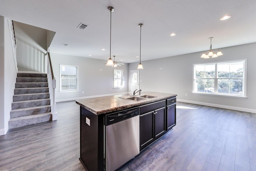 Brand new construction just passed I10 to be completed by Fall 2020! Walk in to an open concept kitchen, dining, and living room area with laminate flooring throughout. A perfect place to host the big game or a party! The kitchen has a large island with stainless appliances. The downstairs also has a half bath for your guests. Head upstairs where you will find four spacious, carpeted bedrooms, two tiled bathrooms, and a laundry room. Both bathrooms maintain a shower, bath tub combo with double sinks and Formica countertops. The master bathroom also includes a walk-in closet. The home features a two car garage and a small, covered patio in the back yard. The yard is completely fenced for privacy. This home is just around the corner from Publix and Chic-Fil-A!Please note the photos are