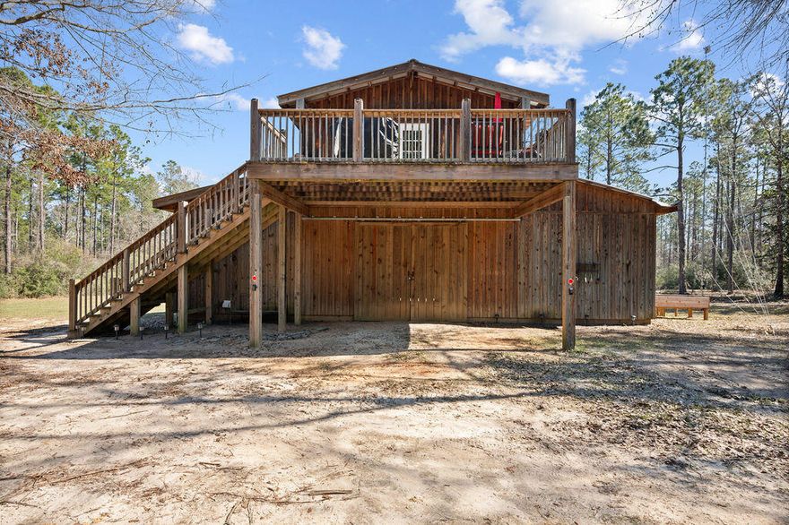 A Sportsman's Dream in Walton Plantation - 25.28 Acres of Outdoor Adventure! Nestled in Walton Plantation, this 25.28-acre, two-parcel property is a paradise for outdoor enthusiasts. Whether you enjoy hunting, ATV and horseback riding, or simply immersing yourself in nature, this non-agricultural farm offers endless recreational opportunities. The land features winding riding trails, a scenic creek, and a 30-amp RV hookup with water and electricity. Additional utilities include a deep well and a 350-gallon barrel septic tank with a leach field, ensuring convenience in this rural retreat. At the heart of the property is a charming 720 sq. ft. barn studio apartment, blending rustic charm with modern comfort. Inside, you'll find floor-to-ceiling blue pine wood, sleek black shaker kitchen cabinets, and stunning quartz countertops. The space includes a built-in king-size bed with extra storage, a walk-in closet, and a bathroom with a stand-alone shower. One of the home's standout features is its two expansive 20-foot-wide decks, significantly extending the living space and offering breathtaking views of the surrounding landscape. Below the apartment is a sprawling 2,000 sq. ft. unfinished barn, offering endless potential for storage, a workshop, or future expansion. A laundry area is conveniently located within the barn. Located in a gated community, residents enjoy miles of ATV trails, numerous fishing ponds, an outdoor skeet/gun range, community garden, a scenic community meadow, an rustic open-air chapel, and community bathrooms. Three gated entrances provide easy access while maintaining privacy. A 1,500 sq. ft. deeded hunting camp is available to community members for an additional annual fee. Full-time residences are allowed, though short-term rentals are not. Internet access keeps you connected, and 4WD vehicles are required for the rugged backcountry roads. Just an hour from Destin's stunning beaches, this private outdoor retreat is a must-see! All information is thought to be accurate but buyers must independently verify anything deemed important.