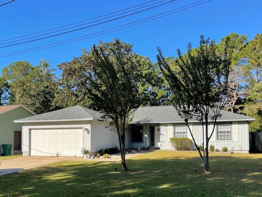 Great location!!! Centrally located in Niceville just minutes from the Eglin AFB, beaches, and Destin-FWB Airport. This 3/2 home sets on a large lot, in a great neighborhood. This home features large living area with cathedral ceilings, wood burning fireplace & formal dining area. Kitchen also has a dining area with all appliances in place, lots of cabinetry & pantry. Master has 2 closets. Ceiling fans in all the rooms! Built in shelving & attic with pulldown stairs for storage. Open deck great for relaxing and entertaining in a large, fenced backyard! New Roof - 2022, Water Heater - 2022 and AC - 2021.