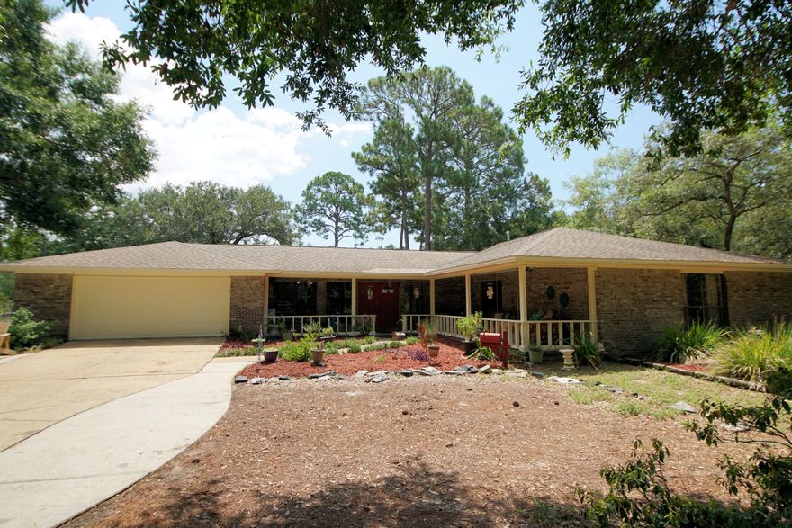 Desirable Bayshore Drive Home. Walking distance to Lions Park with extra income potential. Stand alone cottage with bath, walk-in closet, kitchen and porch. This could easily be used for home business. Minutes from the Bayou. Allow the salt water air to soothe your soul as you curl up with your favorite book on the front porch bed swing. This home is all about ease, comfort and style. The mature trees and large lot offer a peaceful country setting, yet only five minutes from all of Niceville's newest stores and restaurants. The brick exterior not only gives this house a classic homey feel, but also gives peace of mind with it's minimal maintenance, superior strength and durability. You can also enjoy the beautiful landscaping and loads of extra parking