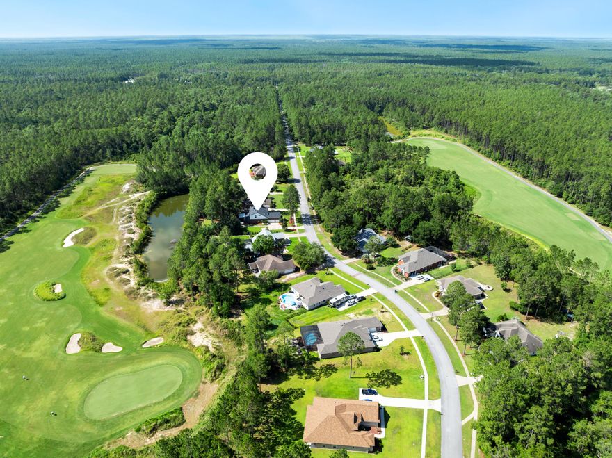 Welcome to this beautifully updated 3,377 square foot home tucked inside one of Freeport's most sought-after gated golf course communities. Set on a lushly landscaped half-acre lot with no neighbors in front or behind, this 4-bedroom, 3.5-bathroom home offers exceptional privacy and a peaceful backdrop of nature and golf course surroundings.Inside, you're greeted by a large living room with soaring cathedral ceilings that create a grand yet inviting space, seamlessly connected to both the kitchen and dining areas. The kitchen features double ovens, ample counter space, and flows naturally into a cozy dining nook, perfect for casual meals or morning coffee. A separate flex space off the entry could be used as a home office or formal dining room, depending on your needs.The primary suite is located on the main level and includes dual walk-in closets and direct access to the screened lanaicreating a private retreat where indoor and outdoor living blend effortlessly. Upstairs, a second living area provides the perfect space for guests, hobbies, or media, while the spacious en-suite bedroom adds flexibility for family or visitors.
Step outside to enjoy the screened lanai that opens to your private backyard oasis, where the view stretches across mature landscaping to a tranquil pond and the rolling greens of the golf course beyond. Whether you're hosting a sunset dinner or enjoying a quiet morning with the birds, the indoor-outdoor flow of this home is truly special.
Additional highlights include a spacious 3-car garage, recent updates throughout, and a brand-new roof installed in 2024. 
This quiet, gated neighborhood offers a range of amenities including a swimming pool, tennis and pickleball courts, a playground, and of course, the golf course itself. Just 10 minutes to Publix and all that Freeport has to offer, and less than 30 minutes to the white sand beaches and turquoise waters of South Walton. This is where peaceful living meets coastal convenience.
