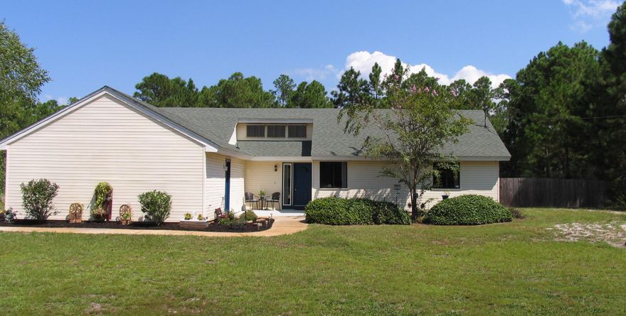 Welcome home to this beautiful pool home on a large corner fenced lot located in the desirable Holley By The Sea. This home boasts tile floors throughout the kitchen, dining room, hallways, and bathrooms. There are 3 spacious bedrooms. Master features on suite bath w/separate his/her closets. In the living room to front foyer, there are vaulted ceilings allowing for 3 Southern exposed windows providing large amounts of natural light to flow in. Walkout to the screened in porch and enjoy the view of the in-ground pool and large fenced backyard with the storage shed. There is a 2 car garage with work-space along one side for tools/etc.