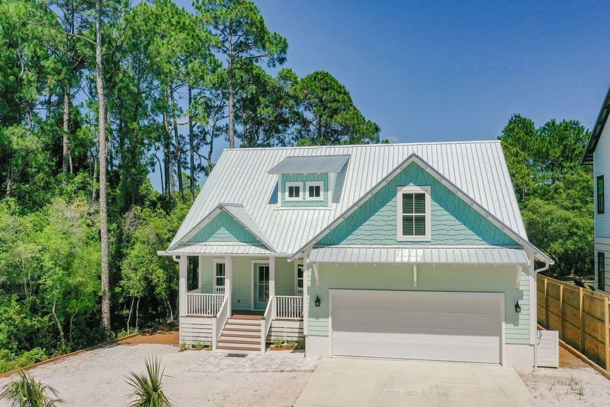 Brand new custom home situated on a 0.9-acre private lot and 0.3 miles to deeded beach access! This home sells full turn-key ready with plans for a custom pool, with approved permits, and complete with quality coastal chic style furnishings. Interior features include shiplap accent walls, luxury vinyl plank floors throughout, quartz countertops, and stainless-steel appliances. The ground floor master suite boasts a luxurious ensuite bath with dual sink vanity and tile shower. Upstairs, 2 additional bedrooms and a bunk room allow plenty of space for vacationers and large families alike. Ideally located just a short bike ride to nearby Seacrest Beach and Rosemary Beach, this modern craftsman style residence is ideal as a rental investment or second home at the beach.