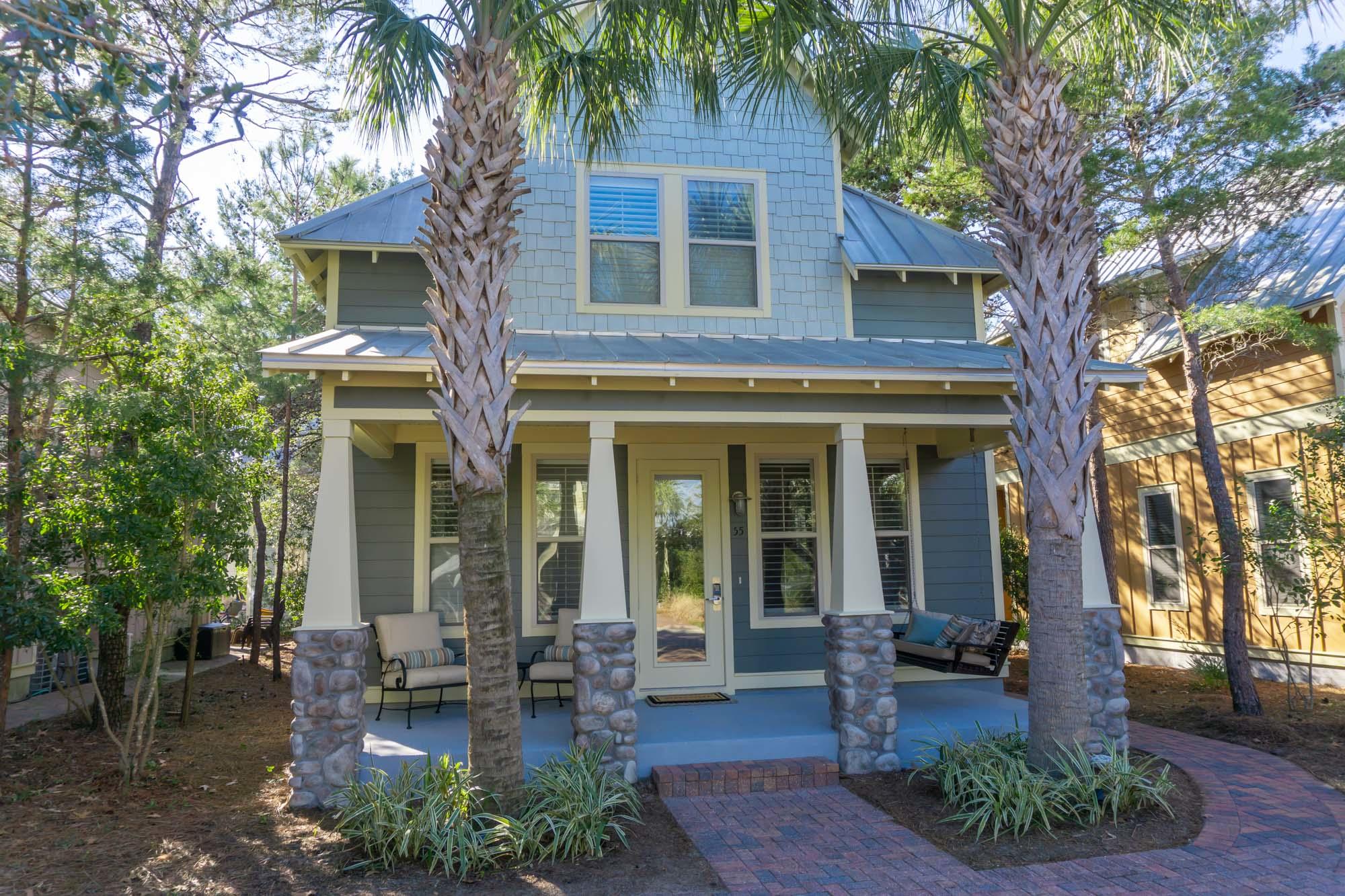 Less than a 1/2 mile walk, bike or golf cart ride to the turquoise waters of the Gulf of Mexico and the sugar white sand beaches of Ed Walline State Park, this pearl of a home sits nestled amongst natural Florida foliage in a quaint neighborhood called the Cottages at Santa Rosa Beach along with 15 other homes. A wonderful bench swing adorns the covered front porch and offers a pleasant place to sit outside and enjoy the salty breeze blowing off of the gulf. The charm of this Craftsman style 3 bedroom, 3.5 bath home includes a first floor master bedroom and bathroom, oversized neutral tile flooring throughout the living area, black flecked granite countertops and white cabinetry in the kitchen and bathrooms, and glass tile backsplash in the kitchen that compliments the stainless steel