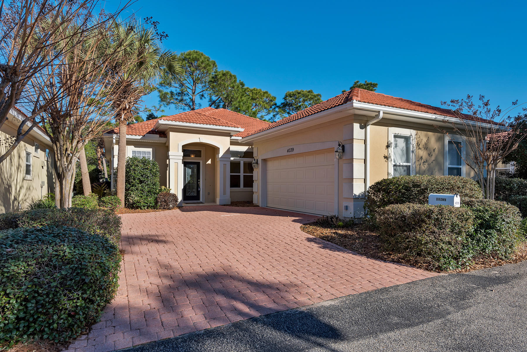 ***MUST SEE***Beautiful home in the exclusive, gated community of Sunset Beach located right on the 7th fairway of the Blue Water Bay Golf Course. This house is in pristine condition with a HUGE screened-in lanai (440 sq. ft), and a gorgeous, open and light floor plan. The exquisite interior, consisting of granite counter tops, gas, water for irrigation included in HOA, fireplace, abundant huge windows and a built-in office, are among the many luxurious features this home has to offer. You have ownership in a gorgeous clubhouse on the bay, sculptured, private swimming pool and sand beach, where you can watch spectacular sunsets from the pavilion.