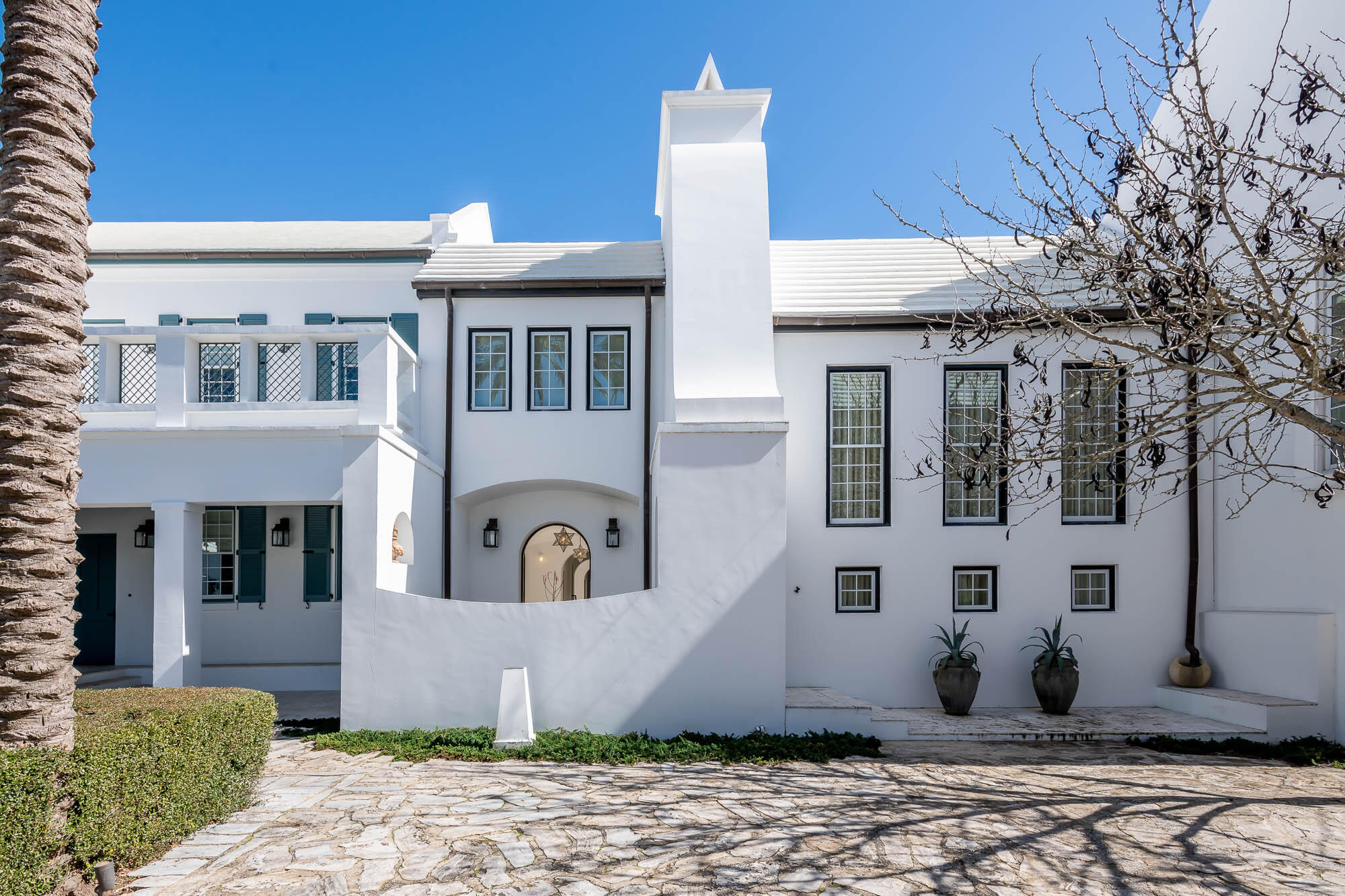 This highly anticipated home was designed by the world-renowned design firm of Miami based Duany Plater-Zyberk & Company, architect & creator for the town design of Alys Beach. The home's design captures all aspects of Antiguan & Guatemalan influences showcasing dual Courtyards, Loggias, Roof Terrace, and dualling Zaguans.The property opens to Sea Garden Walk pedestrian path which leads directly to the Gulf of Mexico and the private owners Beach Club. A 2nd attribute to the pedestrian path is the intimate pocket park with fire pit for afternoon sittings wonderfully landscaped.  The Caliza Pool & Town Center is a short stroll as well.  The 1st level entry through a mahogany gate leads you into the Zaguan and 1st of 2 private courtyards with seating and outdoor grill.  This Courtyard