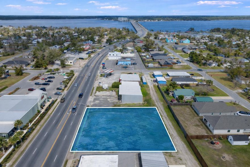 Prime commercial opportunity in the heart of historic downtown Lynn Haven. 523 Ohio Avenue offers 0.34 acres of high-visibility land positioned directly along one of the area's most heavily traveled corridors, with an average daily traffic count of approximately 34,000 vehicles.Strategically located near Bailey Bridge with convenient rear alley access, this site provides excellent accessibility and development flexibility. Surrounded by established businesses and continued downtown growth, the property is well positioned for retail, office, service, or mixed-use development.Proposed plans and supporting documents are available for review, offering insight into the potential build-out and highest and best use.Secure your footprint in one of Bay County's most active commercial corridor