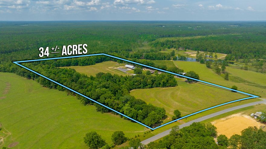 An equestrian lover's dream - this beautiful ranch consists of 2 parcels and encompasses over 33 acres with so much to offer. The beautifully renovated home features a semi open floor plan, wood look tile and a neutral color palette. Spacious living room has a wood burning fireplace; kitchen boasts bright white cabinetry, stainless steel appliances and granite countertops. Both a breakfast area and dining area are adjacent to the kitchen. The master suite features a large custom tiled shower and dual vanities. The large mud room and laundry room make clean up more efficient. All of the bedrooms are a good size. Nice screened in back porch leads to a nearly new gunite pool (installed in August 2022) w/ paver surround. A 5,000 sq barn s ready to house all your farm equipment and toys. Approx