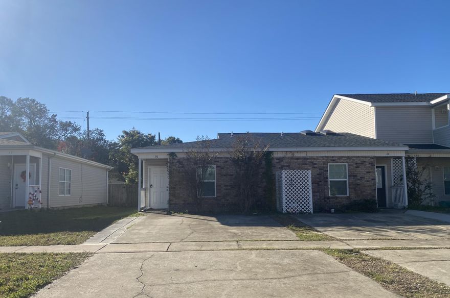 10K PRICE DROP! NOW VACANT AND MOVE IN READY! This is a great opportunity to own an updated townhouse located close to downtown FWB! Open floorplan with 2 bedrooms and 2 full baths on one level. Indoor laundry, washer and dryer included 'As Is'. Fenced backyard with large covered rear porch. End Unit. No HOA.The unit was significantly updated in 2020. Updates include LVP and tile flooring, new appliances in kitchen, and granite countertops. New HVAC in 2024, Roof was replaced in 2020.Ideally located near downtown shopping and dining, and both military bases.