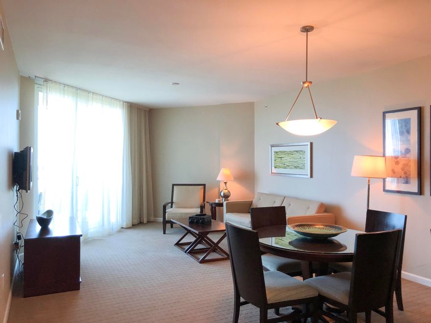 This top floor westerly facing junior two-bedroom condo offers views over the City of Destin and the Gulf of Mexico. It has an open concept living and dining area, as well as an inviting large balcony. The lagoon pool and water features are the resort's crowning attractions. Onsite amenities include multiple pools with waterfall features, a hot tub, playground, fitness center, and tennis and basketball courts. Also, newly added, is an on-site restaurant offering lunch, dinner, room service and even in-season poolside service. Shuttle service to the June White Decker Public Beach access is offered in-season. All utilities are included in HOA dues  water, sewer, electric, cable, WiFi, phone, trash! Excellent opportunity for a vacation rental, second or primary home.