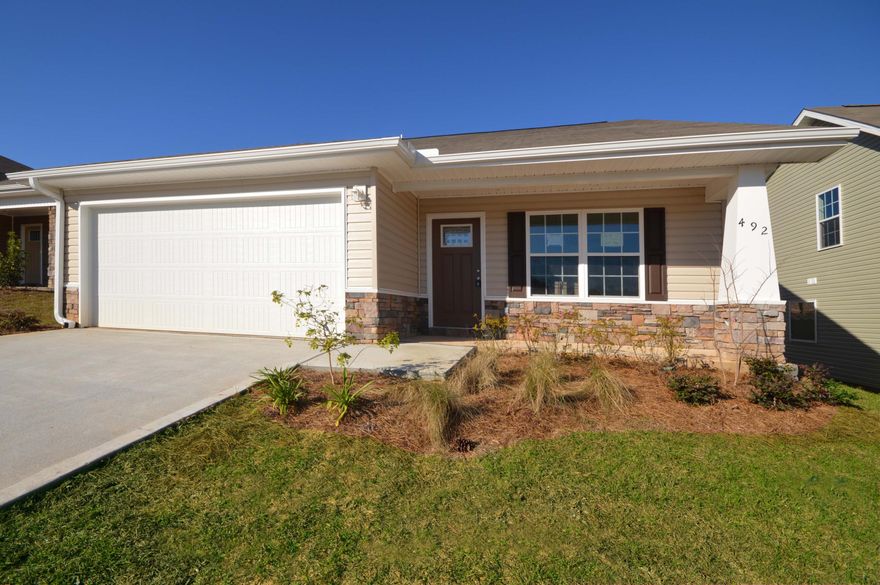 New construction with 5 bedrooms that is cheaper than renting. This two story home in award winning Stillwell Estates has a Master suite downstairs, walk-in closet, dual vanities, garden tub, and separate shower. Living room, dining room, kitchen with breakfast bar, pantry, smooth top stove and built microwave. Inside laundry and two car garage. Upstairs are four additional bedrooms that share a full bathroom. Upgraded laminate flooring in foyer, living room, kitchen and dining room. Kitchen with side by side refrigerator and pendant lighting over the breakfast bar that looks into the dining area. French doors open to cover patio. Stainless Steel appliances and white faux wood blinds throughout. With preferred lender, seller will pay $2400 of buyers closing costs. Additional items:
 *Ceramic smooth top stove *built in microwave hood combo *Powder room w/pedestal sink *all bathrooms brushed nickel fixtures *18x18 tile floors in baths *Framed mirror over double vanities *Decorative light globes fixtures *