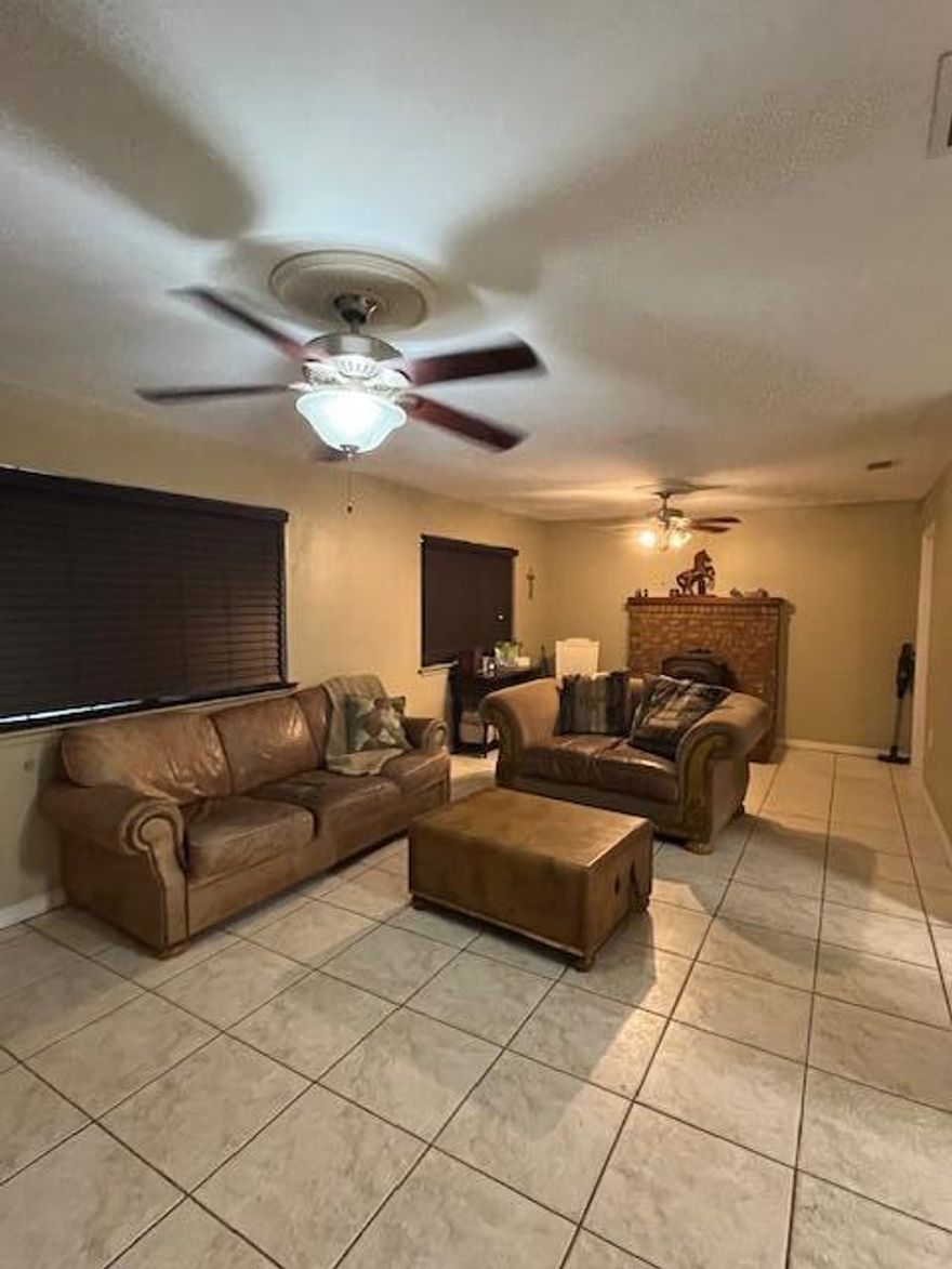 This charming 1985 three-bedroom, two-bath all brick and stone home in Fort Walton Beach, Florida, is full of potential! Featuring a metal roof, a cozy cast-iron fireplace, a bonus room, and a spacious open floor plan. The landscape outside includes two Koi ponds, a fully fenced in yard and double access to the back yard from the street behind. One  bathroom has been completely remodeled, however the silver mirrors do not convey. The metal roof is approximately 15 years old and the hot water heater approximately 10 years old. Home is being sold AS IS. Call today and let's make a deal!