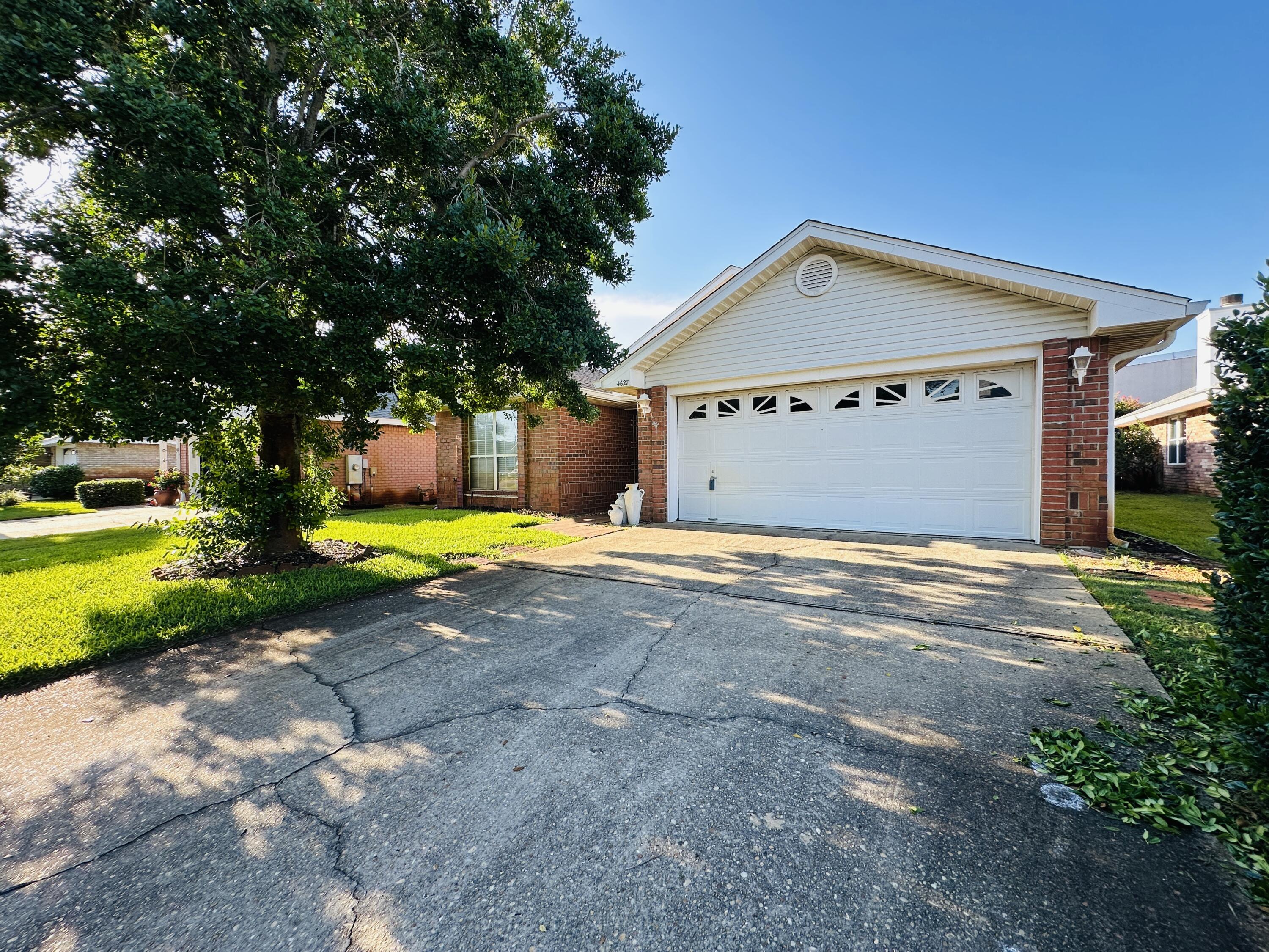 SHORT TERM RENTALS ALLOWED. This is one of the larger 3bd/2bth homes in the neighborhood. Unfurnished and the inside needs updating. 2 CAR GARAGE. NEIGHBORHOOD POOL. This home will need a new roof and it can be installed before closing. Roof Bids of $13,500 to $15,000. Enclosed deck on the back. Fully fenced. Lots of potential and priced to sell to someone that wants to upgrade this home and personalize it. Close to the beach.