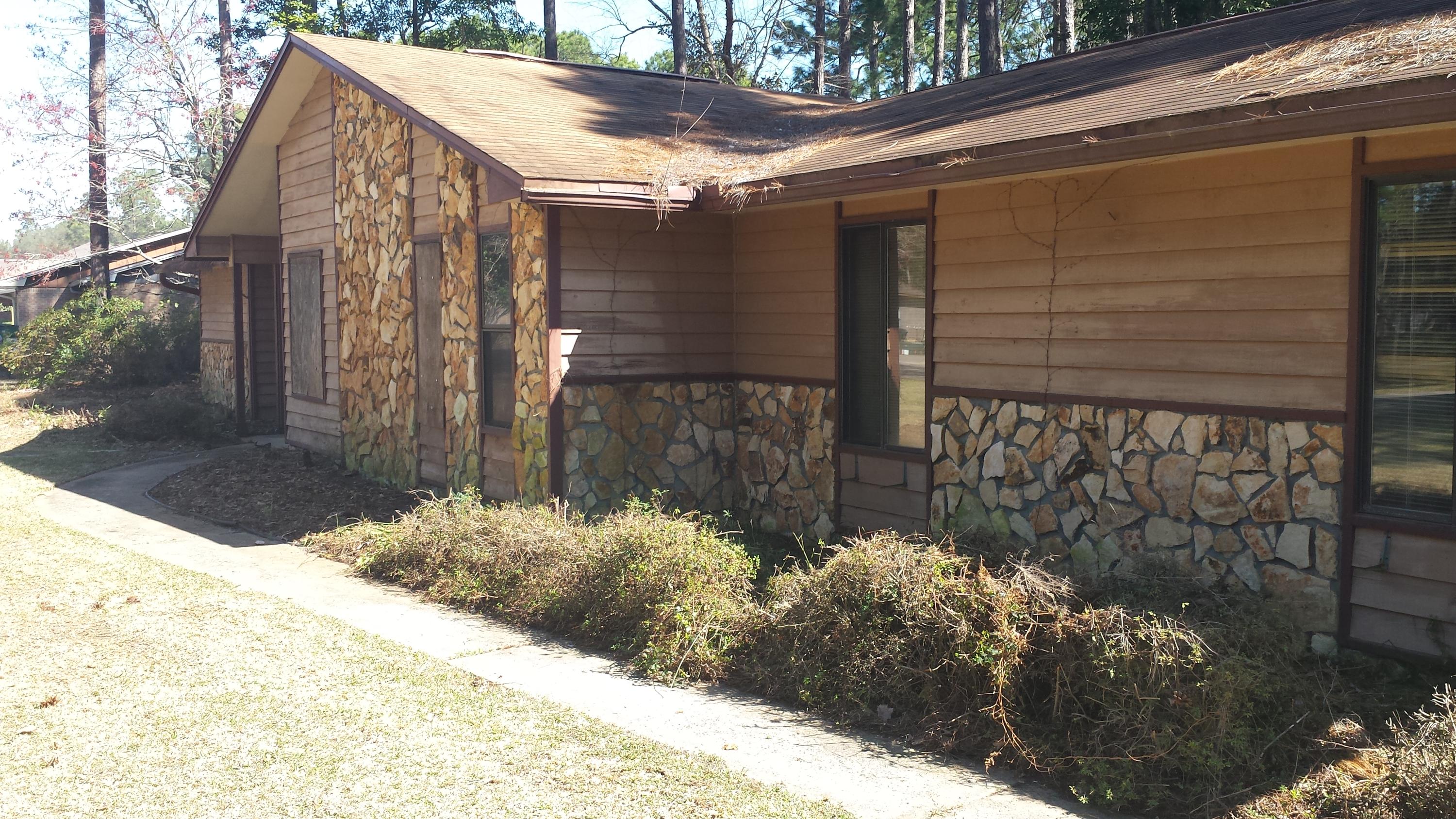 This home is an investors dream. There are a number of repairs needed, primarily on the interior. There are no appliances, and a large part of the drywall has been removed. Large corner lot in quiet neighborhood with mature trees. Side entry with oversized garage. This home is being sold as is. Agent has an engineering analysis on file. No disclosures or warranties available. No utilities connected at present time and cannot be connected for inspections.