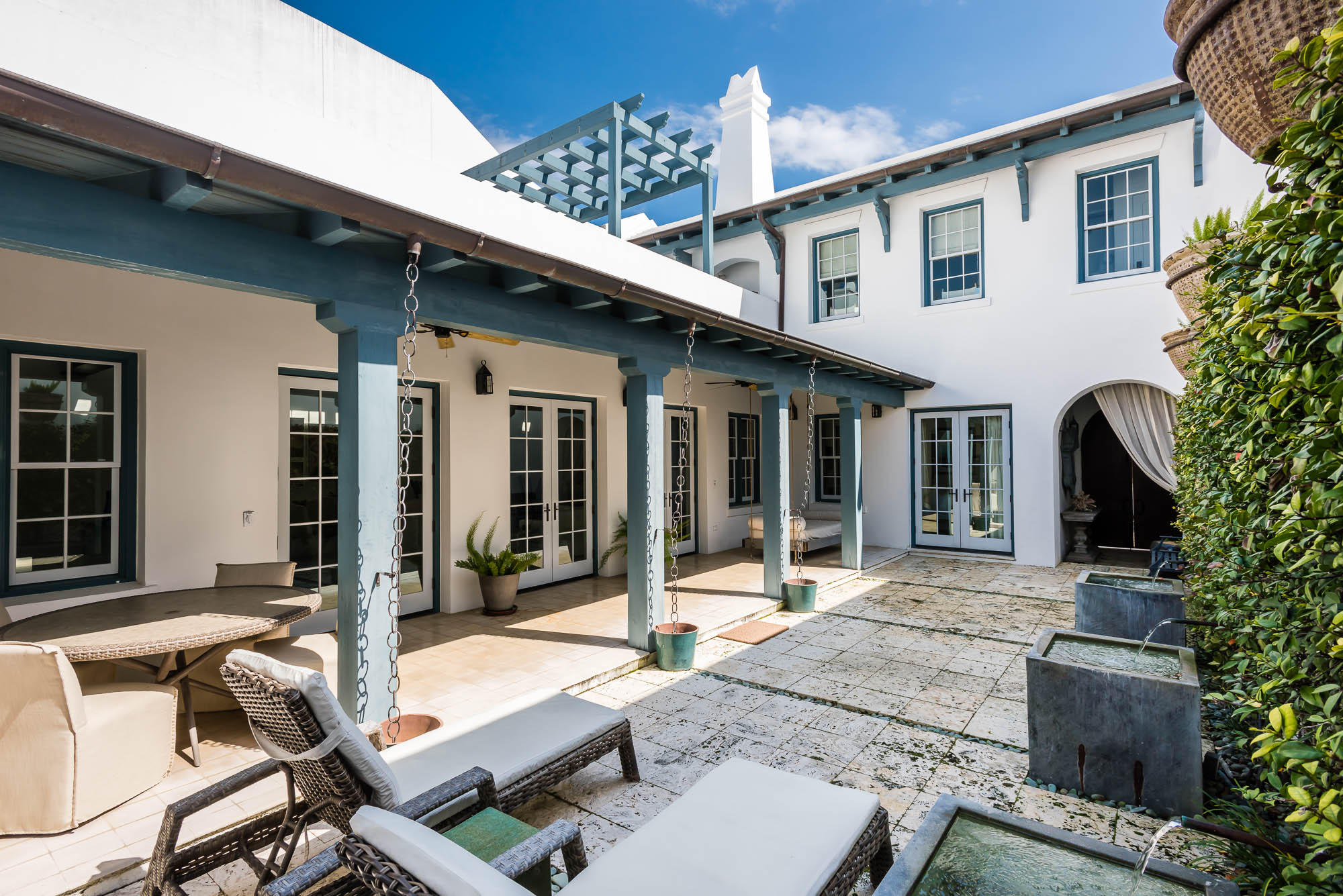 Enjoy summer nights from the rooftop terrace of this 2,436 square foot Alys Beach home. Its location on the pedestrian path, Sea Garden Walk, is just a short stroll from the beach access to the south and Lake Marilyn to the north. The first floor master suite and guest suite open to the spacious courtyard and sounds of the bubbling fountains. The second floor guest suite enjoys a very private loggia that overlooks Sea Garden Walk. Professional interior designs are appointed by the Musso Design Group from Atlanta, GA. This home is green outfitted with terrazzo floors, reclaimed wood on the second floor, dual-flush toilets, an ultra-efficient and durable hot water tank, a heating & cooling system that shuts off when windows/doors are left open, and terrace sky lights for extra