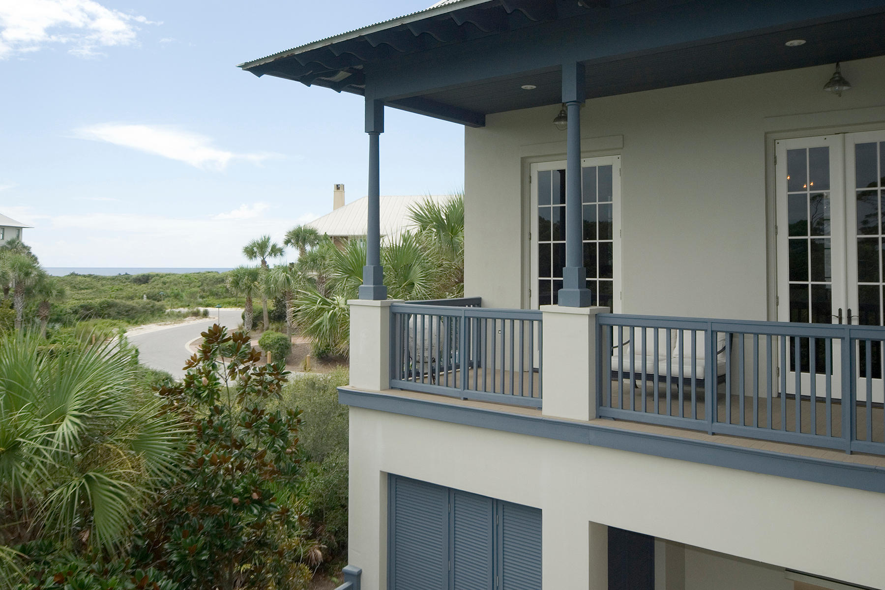 This elegant home in The Retreat designed by Matt Savoie was completed in 2007. Its location along the serene nature preserve provides both its indoor and outdoor living spaces with exceptional privacy. Interior appointments by Susan Massey resonate with the sophisticated finish choices to make a unique statement. Simple, easy care concrete floors that carry throughout the first floor are transformed with an acid wash finish in rich shades of brown. Two guest bedrooms with private baths can be found on this floor along with a spacious laundry room and home office with built-in desk and cabinetry. Overlooking the nature preserve is the spacious pool deck. Covered porches give way to a sun deck that surrounds the heated pool with spa and waterfall feature.
