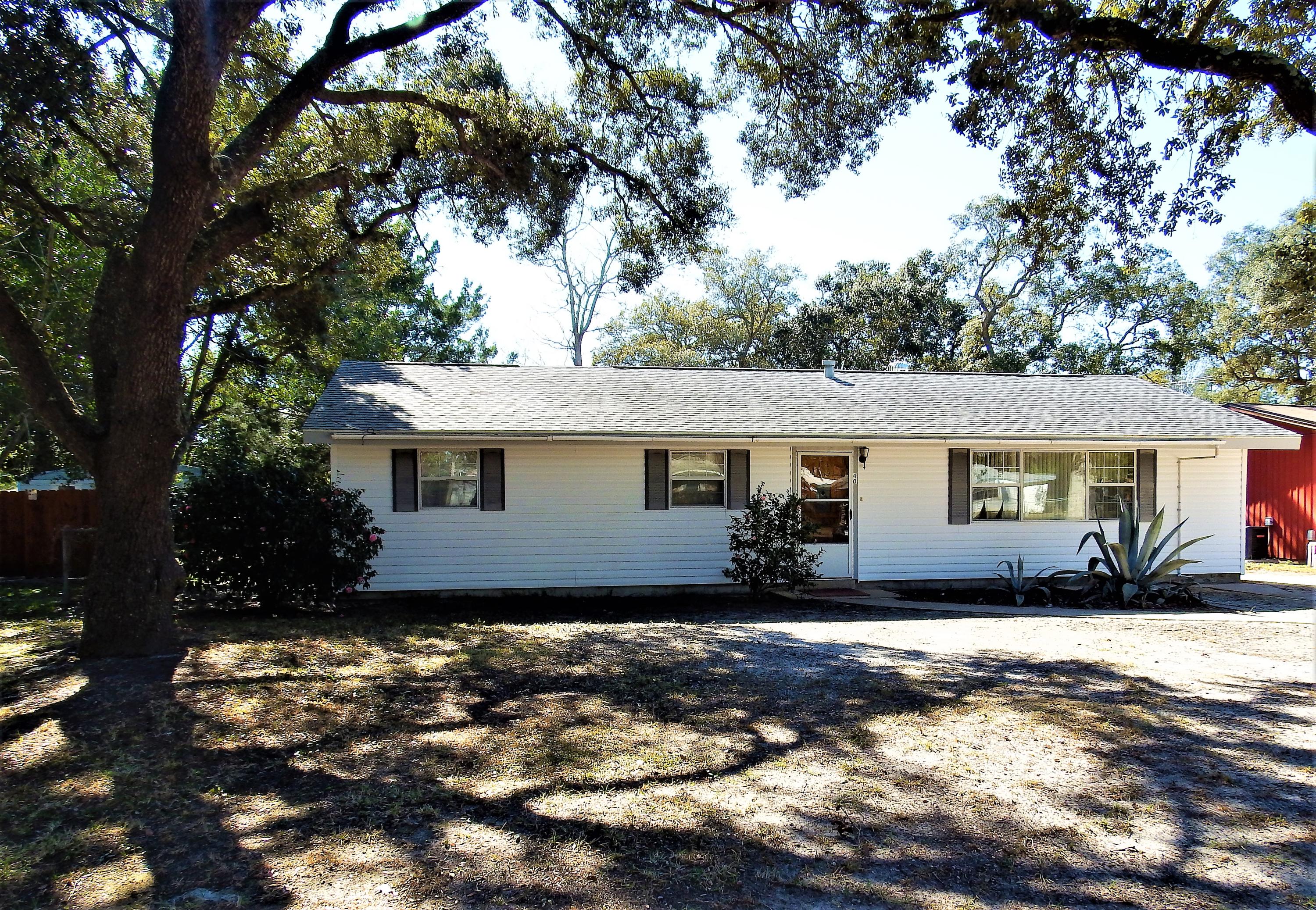 Great starter home located among beautiful oak trees, in the heart of Fort Walton Beach! Brand new carpet & fresh interior paint throughout! The large Master Suite area boasts a 14x11 walk-in closet & the Master Bath comes complete with a 57 gallon jacuzzi tub, with its own heating element, so your water will never go cold! FL Room features windows that will withstand up to 140mph winds! Nice sized backyard with a 12x12 shed, complete with electric, cable, & AC window unit. Whole house generator that will run everything, except for the AC should the power go out. Roof is ~5 years old, HVAC unit replaced in 2011, & brand new water heater installed in December 2016! Check out the documents tab for more features this home has to offer! Call today to schedule your own private tour!!
