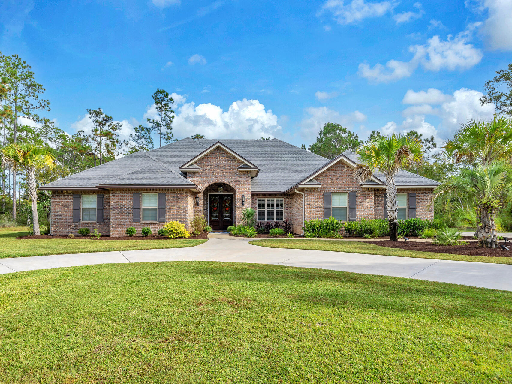 STUNNING Bay Harbour home! 38 Forest Harbour is a single-story custom home thoughtfully situated on a generous, private & beautifully landscaped corner 1.3 -acre double lot. This Choctawhatchee Bay front neighborhood is most sought after. Custom built in 2017 this spectacular one owner home is now available. Flood insurance is not required. Enjoy low Walton County Florida taxes and low HOA dues in this beautifully maintained, Freeport, Florida community. Bay Harbour is a single-entry neighborhood with only 116 lots, a few of which are double lots. The community boasts 170+ acres of nature preserve and large homesites to ensure privacy. Community amenities include tennis courts, hiking trails, owner's boat & RV locked storage and a boardwalk the Choctawhatchee Bay front dock and gazebo. 38 Forest Harbour offers impressive curb appeal with its large, private lot, mature, low maintenance landscape, circular drive & ground level entry. The charming front porch draws you into the warmth and luxury of rooms with hand scraped engineered wood floors, soaring ceilings, crown molding and loads of windows! The three bedrooms and three bonus rooms are a MUST SEE! The remote bonus room currently serves as a library and could be an in-law suite, hobby room, or office! Bring your sports gear, kayaks, tools, and toys! The oversized car garage with attic pull down stairway offers ample space for hobbies and storage with easy access! Built for comfort and convenience by award-winning Tidwell Custom Homes this energy efficient home has no wasted space! The enormous great room and impressively appointed chef's kitchen has stainless appliances a six burner Bosch gas cooktop, custom cabinetry, copper farm sink and inlaid Louis XV Coat of Arms. No detail was overlooked! The expansive, walk through butler's pantry with wine refrigerator and tons of storage and the huge laundry room are a few of the many reasons to fall in love with this home. Your elegant bayside lifestyle awaits! Uniquely designed to bring the outside in, the two porches offer space to breathe. Life in this home is relaxing! Whether enjoying solitude or entertaining friends and family, this home has space for you and your guests to enjoy. Do not miss your chance to step into this enchanting Forest Harbour home! Schedule your private tour today!