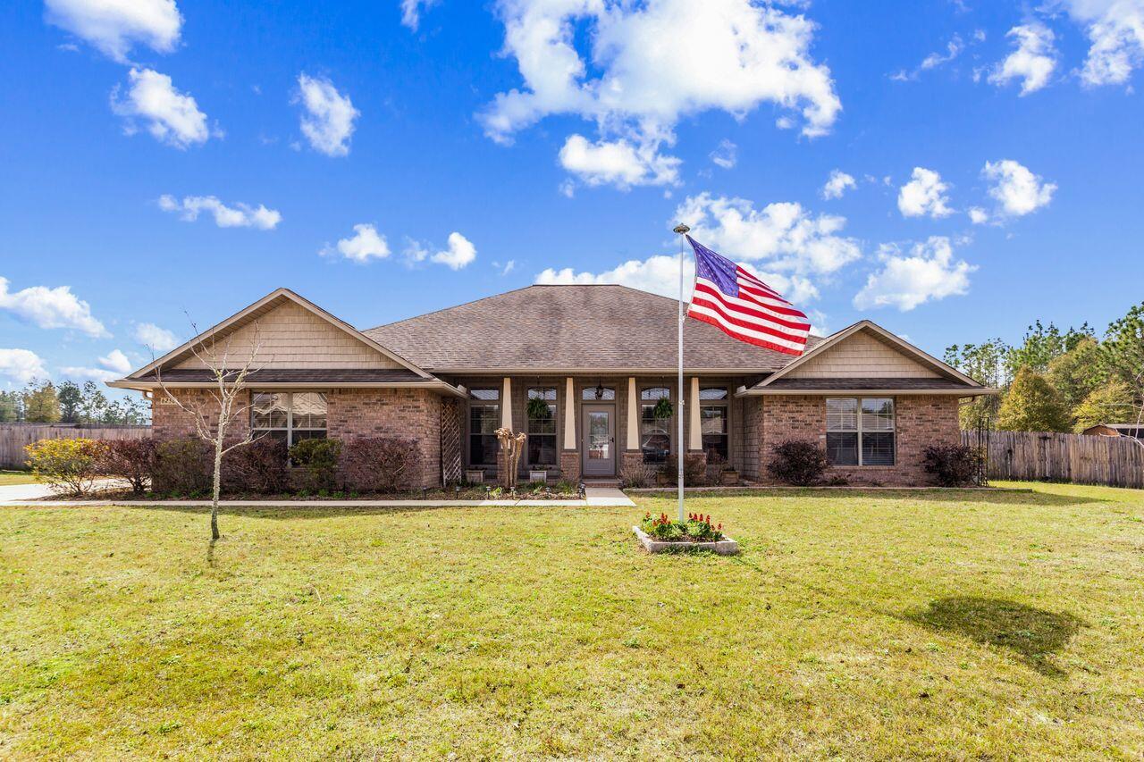 Under contract with a 72 Hour kick out clause! Beautiful craftsman style home located in North Crestview, which means county taxes! All the features you could ask for: cathedral ceilings, granite countertops,Step into your exquisite high-ceiling craftsman-style home nestled in North Crestview, boasting a spacious over half-acre lot and a dedicated workshop. Enjoy the advantages of low taxes and the absence of Homeowners Association (HOA) fees, making this an ideal living environment.Immerse yourself in the grandeur of cathedral ceilings and expansive open tray. Indulge in the luxury of a gourmet kitchen featuring granite countertops, a custom backsplash, under-mount lighting, a granite island, stainless steel appliances, a concealed beverage center refrigerator with a sleek design, a flat-top induction range, and an oven. Add a touch of elegance with a custom feature mantle adorned with a cozy electric fireplace. Separate formal living and dining rooms provide ample space for entertaining.
Beyond these amenities, a detached workshop/garage with a carport offers versatility for projects and storage. Hurry make it yours today! Call for a viewing! New HVAC 2021! Bonus even has a handy built in central Vacum system!