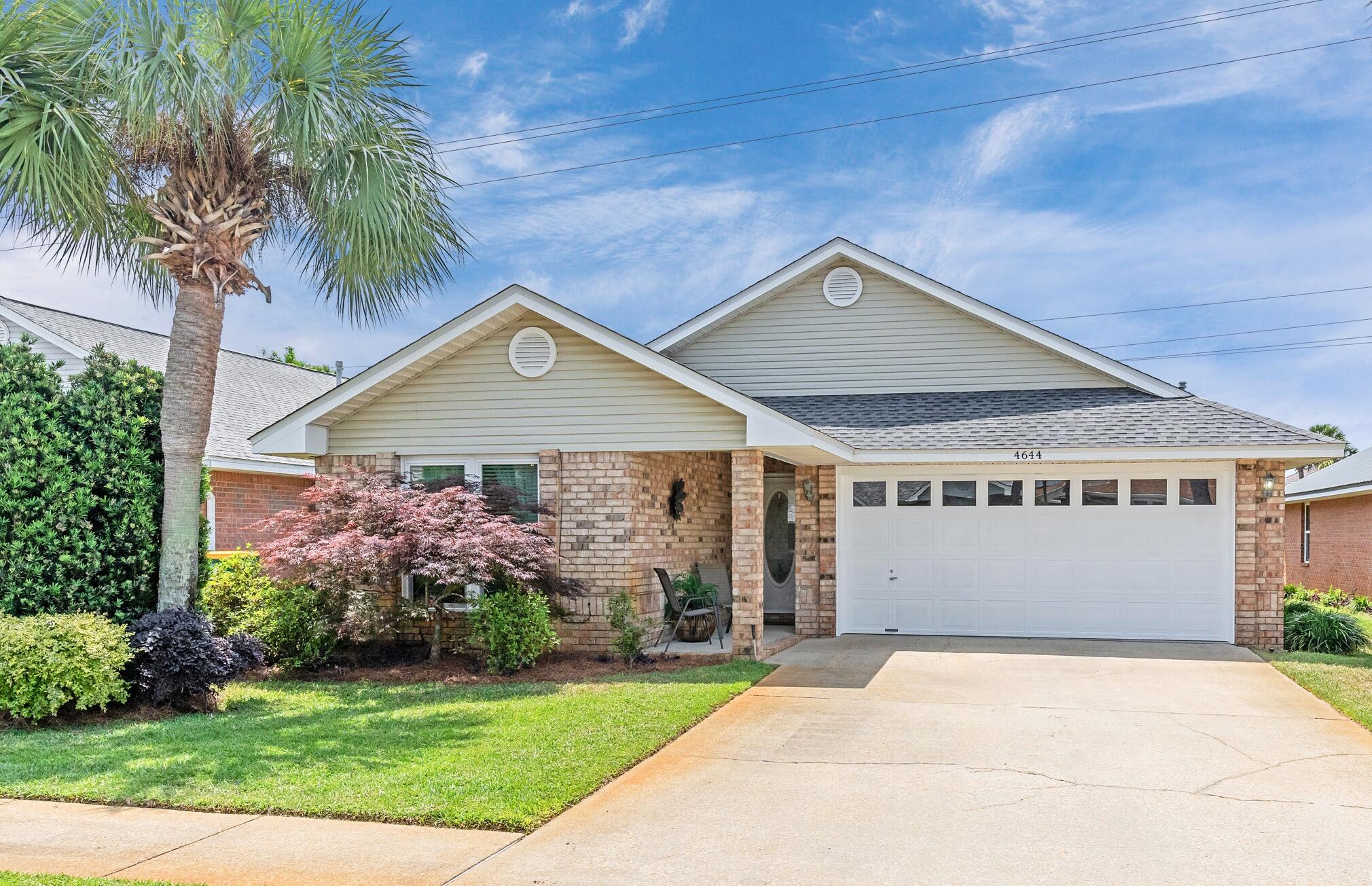 This charming 3-bedroom, 2-bath home has a spacious split floor plan and vaulted ceilings is move in ready!  This house comes partially furnished and has a ton of upgrades including a new roof, new HVAC and water heater, fresh paint and newly added hurricane impact windows for safety and energy efficiency. Located just minutes from Destin's stunning white-sand beaches, this home also offers access to a community pool and super low HOA fees, making it ideal as a primary residence, vacation getaway, or investment property.