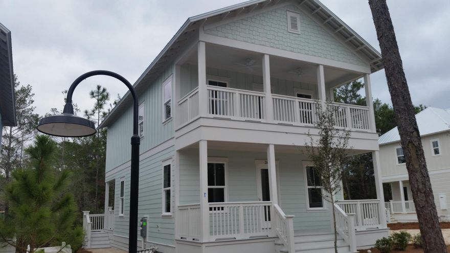 THIS NEW BEAUTIFUL BEACH STYLE HOME is just a SHORT WALK to the MAGNIFICENT WHITE BEACH SANDS and EMERALD GREEN WATERS. The Bayview plan offers three bedrooms, two and half baths with a large covered front porch and a covered porch leading out from the master bedroom on the second floor. It also has a covered back porch that backs up to a natural area! It has a large open living, dining and kitchen plan for entertaining. Stainless GE Appliances, Granite throughout, Hardwood Floors in Kitchen, Family, Dining and upstairs landing/hallway. Please call today for a showing.