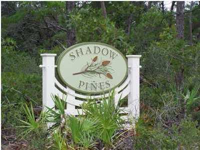 Lot located in Shadow Pines subdivision which offers lots of privacy and nice wooded areas. This is a small community offering sidewalks, street lights and a pool. Nearby beach access and is near Gulf Place which features Artists, shops, restaurants and music venues. This is a perfect lot for your beach cottage!!!!