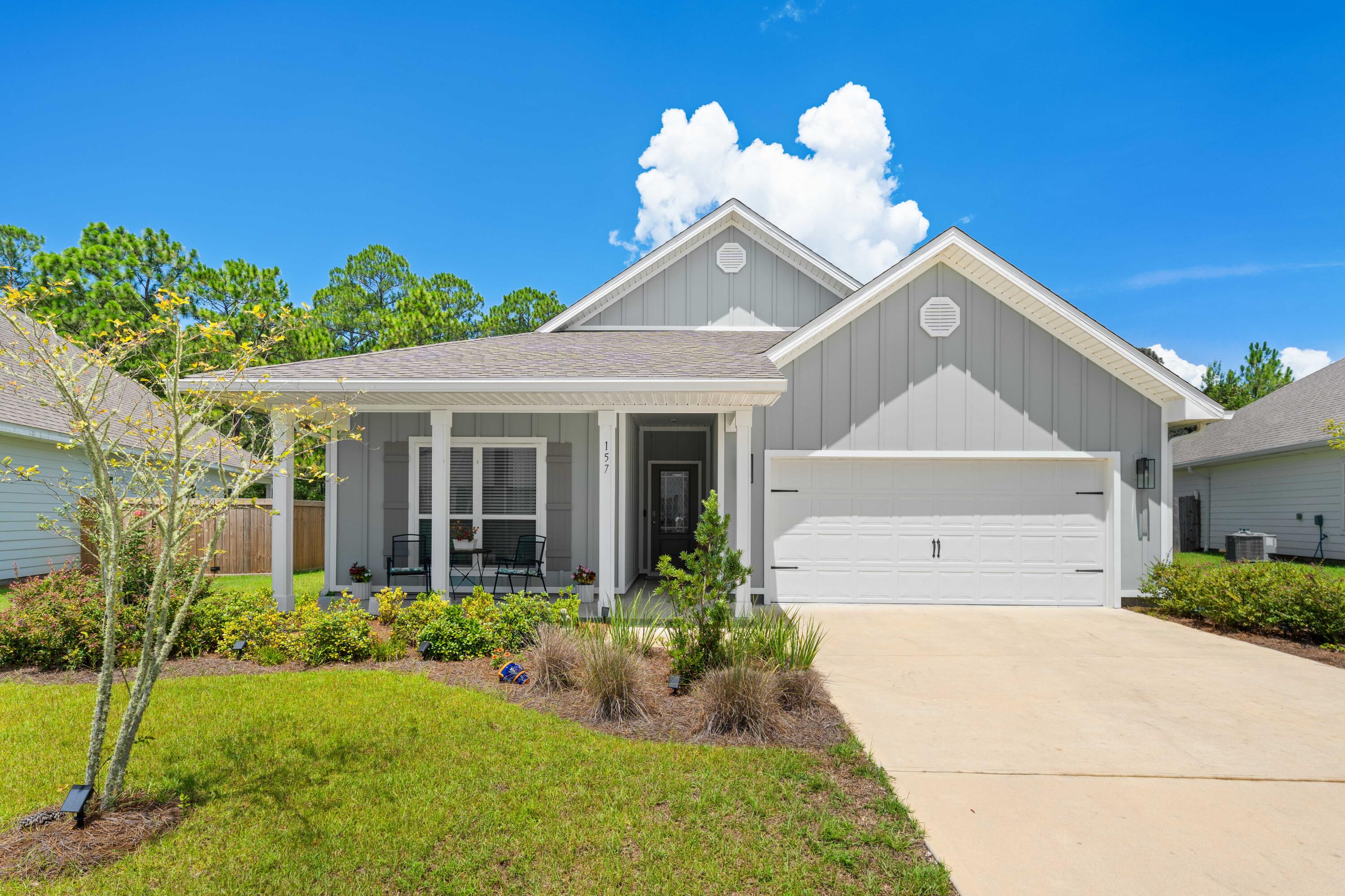 Timeless elegance can be found in this well maintained craftsman style home located in The Preserve at Paradise Cove in Point Washington. Backing up to a wooded preserve and surrounded by lush landscaping, this 4 bedroom, 2.5 bath and 2-car garage home offers year-round privacy and relaxation. Experience the ease of convenience with quick access to the Choctawhatchee Bay, South Walton's white sand beaches, the many towns along 30A, Eden Gardens, as well as numerous hiking and biking trails. Featuring stainless steel appliances, professional lighting, screened back porch, smart home technology package, shaker style cabinets, stunning finishes and fixtures, quartz countertops, and wood-grain EVP flooring throughout. Claim your private oasis amongst Point Washington's natural beauty today! Additional property features include 9' ceilings, stainless steel appliances, quartz countertops throughout, smart home technology package (KwikSet keyless entry and Skybell doorbell), automated front porch lighting, Echo Dot device plus Quolsys touch panel that can be integrated to control home's lighting, thermostat, front door and more. The Preserve at Paradise Cove is a charming community located in Santa Rosa Beach, FL and offers peace, quiet, and convenience being a short drive to 30A's white sand beaches, top-rated schools, Choctawhatchee Bay, numerous state park trails, Destin, Panama City Beach, and more. Claim your retreat in The Preserve at Paradise Cove today and enjoy the best of coastal living!
