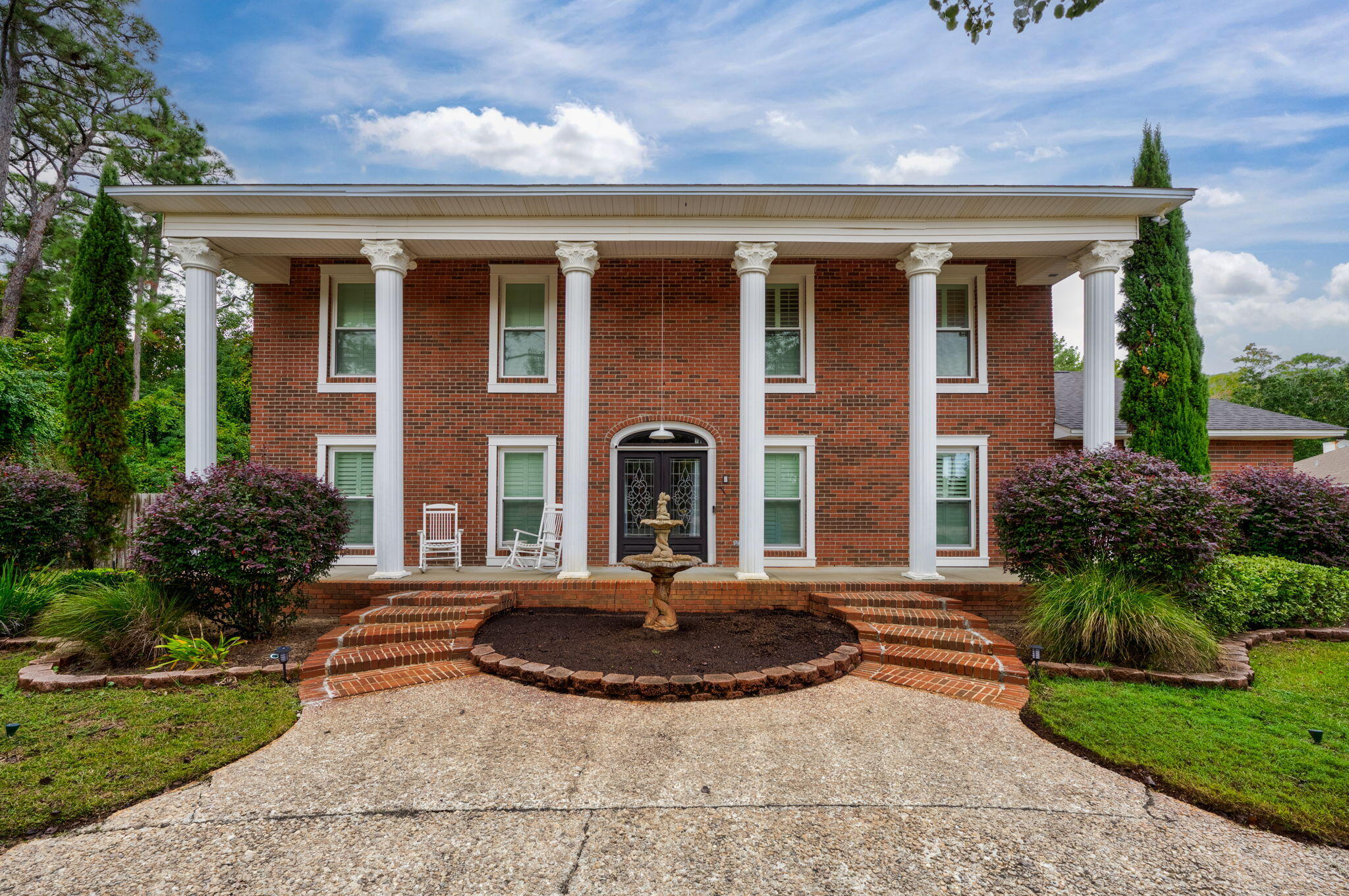 This stunning 6-bedroom, 4-bathroom colonial-style estate has been thoughtfully upgraded, providing luxury and peace of mind! This home features a whole house generator, new impact glass windows, a new outdoor pool screen enclosure, hurricane screens for exterior doors, new carpeting and fresh paint throughout, plantation shutters, and crown molding. As you enter, a grand staircase creates an immediate statement of elegance. To the left of the staircase, the formal living room flows into the family room through pocket doors, featuring a full wet bar and a cozy fireplace--perfect for entertaining or nights with the family! To the right, the formal dining room leads seamlessly into the gourmet kitchen, where you'll find brand new double wall ovens, granite countertops, an island, a breakfast bar, a dining area, and an enormous walk-in pantryeverything a home chef could dream of! The main level includes 2 bedrooms and 2 full bathrooms, providing plenty of space for family and guests. Upstairs, you'll find 4 additional bedrooms, including the oversized primary suite. The primary bedroom has room for a sitting area and features a walk-in closet with built-ins offering ample storage. A serene retreat awaits in the primary bathroom, with travertine tile throughout, a garden tub, a separate shower, a double vanity with granite countertops, and a private water closet. The outdoor space is a true highlight, with a stunning screen-enclosed saltwater pool, a covered deck perfect for outdoor dining, and a fenced-in yard. Additional features include a 2-car garage with storage shelves, cabinets, a universal Tesla EV charger, a large driveway that provides ample parking space for a boat or RV, and a large utility room that can be used as a flex room. Situated on a quiet street with no HOA in the heart of Oriole Beach, this home offers over 4,400 square feet of living space designed for elegance and practicality. 
