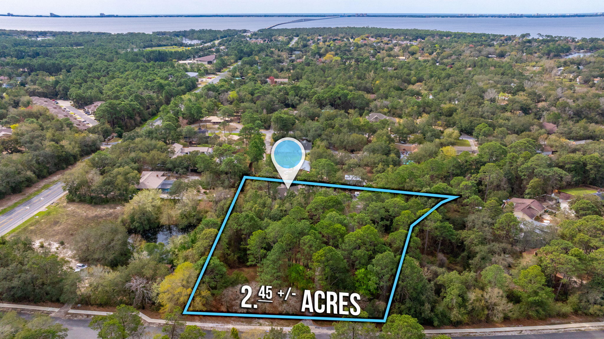 2.47 acre piece ideally located for Multi Family in Bluewater Bay. Property is Okaloosa County, zoned MU-1 (25 Units per Acre), Bluewater Elementary and is located outside the Bluewater DRI. The Property currently has a home with an additional structure. Property is selling as Vacant Land, all structures are considered 'As-Is'.