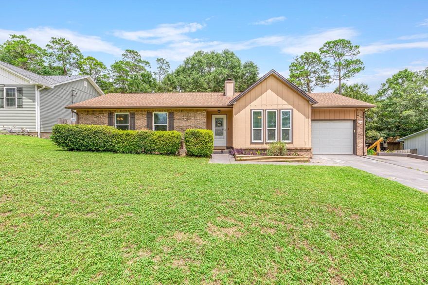 Welcome to your new home! Don't miss out on this  recently upgraded gem located in the heart of Niceville! This  3 bedroom 2 bath brick home is situated on more than a quarter acre of lush grass and mature trees and features a designer inspired interior. The beautiful weathered brick fireplace with stained-wood mantle is prominently featured as the focal point of the living room and sets this home apart from the rest. The spacious heated and cooled Florida room that looks out over the back yard provides a wonderful second living area in a relaxed setting. The upgraded eat-in kitchen features stainless steel appliances, custom painted cabinets and extra pantry space. Roof is 7 years old, Water heater is only a couple years old. Sellers have a transferrable home warranty.