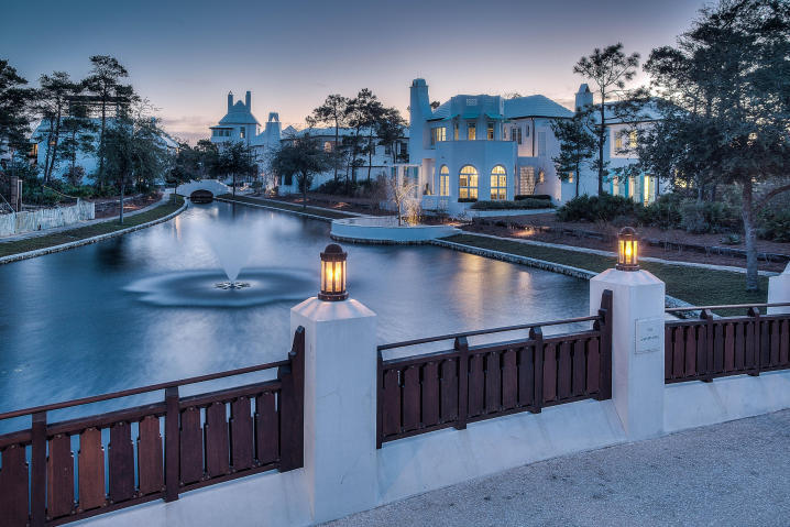 Gorgeous home overlooks Lake Marilyn in Alys Beach. Outdoor living at its finest with heated saltwater swimming pool and fountain, poolside arbor with grille terrace, covered dining and fireplace. Home is offered furnished.