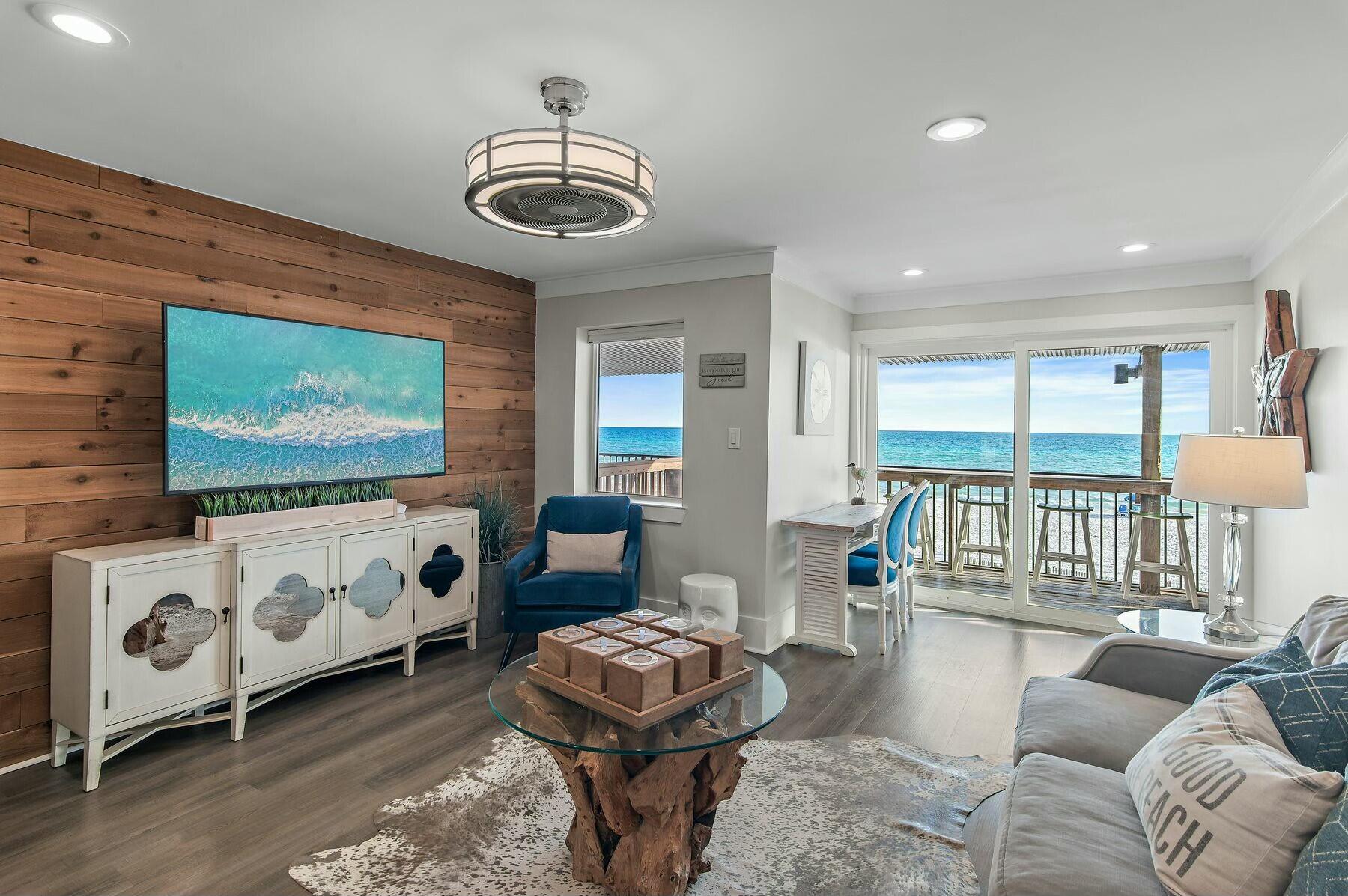 Positioned directly on the sugar-white sands of Walton County, this exceptional three-story townhome in Costa Del Sol captures breathtaking gulf views from every level. Thoughtfully remodeled and professionally furnished, this turn-key retreat offers a prime investment opportunity with a strong rental history and sleeping accommodations for up to 12 guests. Upon entry, the main living area showcases floor-to-ceiling gulf views, complemented by designer furnishings and an inviting, open floor plan. The adjacent dining space features a custom-built booth that blends seamlessly with the sleek, modern kitchen outfitted with stainless steel appliances, ceiling-height cabinetry and pristine white countertops. The ground floor presents a private mother-in-law suite, accessible from the beach level porch, making it an ideal setup for multi-family stays. This level includes a second living area with a sectional sofa, flatscreen TV, bar, and built-in twin bunk, along with a spacious bedroom featuring a king bed, twin bed and twin trundle. The boardwalk leads directly to the beach access, ensuring uninterrupted coastal views. On the top floor, two king suites with private bathrooms provide luxurious accommodations. The primary suite boasts a private balcony, offering a front-row seat to mesmerizing gulf sunsets. Each bathroom is equipped with upgraded rainfall showerheads and high-end finishes, delivering spa-like comfort. Recent updates include new shower enclosures, two HVAC units, and a new microwave, ensuring modern efficiency. Centrally located between Pompano Joe's and Frangista Beach, this townhome is just moments from renowned gulf-front dining, boutique shopping and premier entertainment. With a high-performing rental history and exceptional design, this is an investment-worthy retreat that redefines beachfront living. With rental history and rental projections ranging from $64,000-$114,000, depending on owner usage, this one is a fantastic opportunity for any gulf-front buyer. The voluntary HOA includes management, internet and pest control.