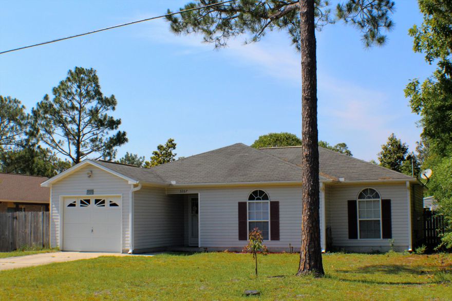 Seller will provide 1 year home warranty! Seller willing to assist with some buyer closing costs! Save yourself some money by paying county taxes, but still live close to schools, public library, Post Office and shopping. Main area of the house has a ceramic tile, all through out, carpet in all three bedroom. You will love the high cathedral ceiling in the living room. 2 storage buildings convey in ''as-is'' condition. Buyer's agent to verify square footage.