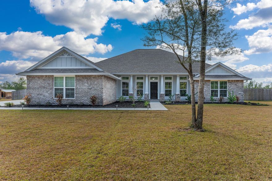 WOW! This spacious 4 bedroom, 3 bathroom ,3 car garage home on 1+/-acre of land.As you step into the entry way of the home it is flanked with home office on one side and dinning room on the other.The open living floor plan is spacious enough for family get togethers or having friends over for dinner with a wood fireplace in the living room.The kitchen features stainless steel appliances, large kitchen island complete and plenty of cabinet space. The large master bedroom is wait for you to fill it with your furniture design. The master bathroom has shower, garden tub and double closets. The additional three  bedrooms are also spacious. The living room back door opens to the Lanai with a view of the saltwater pool and back yard. The property has a well and irrigation system.