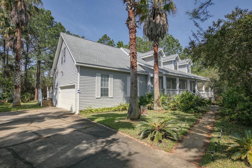 Positioned steps away from the SANTA ROSA GOLF COURSE and a quick 5 minute golf cart ride to the beach, this home offers the best of both worlds.  There's over 50 feet of screened and open back deck space that wraps around into a sizable front porch.  3 BRs w/ a bonus room above the 2 1/2 car garage offers plenty of living and storage space.  NO HOA fees but buyers can join the Santa Rosa Golf Club and enjoy tennis courts, pool and private beach access.  Home has a termite bond and security system that can be transferred.  No flood insurance required.