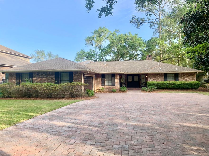 Spectacular, open waterfront with 125 ft on the bay! 3 bed, 2 bath with living rm, dining rm, Florida rm, kitchen, laundry room, screen porch, 2 car garage, HUGE lot with 2-story dock and double jet ski lift. Since 2011, upgrades include new roof ('11), flat ceilings,new dock w/ lift ('12), new tile flooring throughout ('12 and '17), updated kitchen & master bath ('12-'13), new paint, crown molding ('12-'13), whole house interior new paint ('18), custom cabinetry in garage ('16), brick paved driveway ('15), brick paved screened patio and brick paved open patio ('15), brick fire pit ('16), new HVAC ('15), new water heater ('12), new walk-in shower in bath 2 (2021), updated laundry ('12), backyard lighting added. Termite bond, floored attic. New backyard Zoysia ('21).