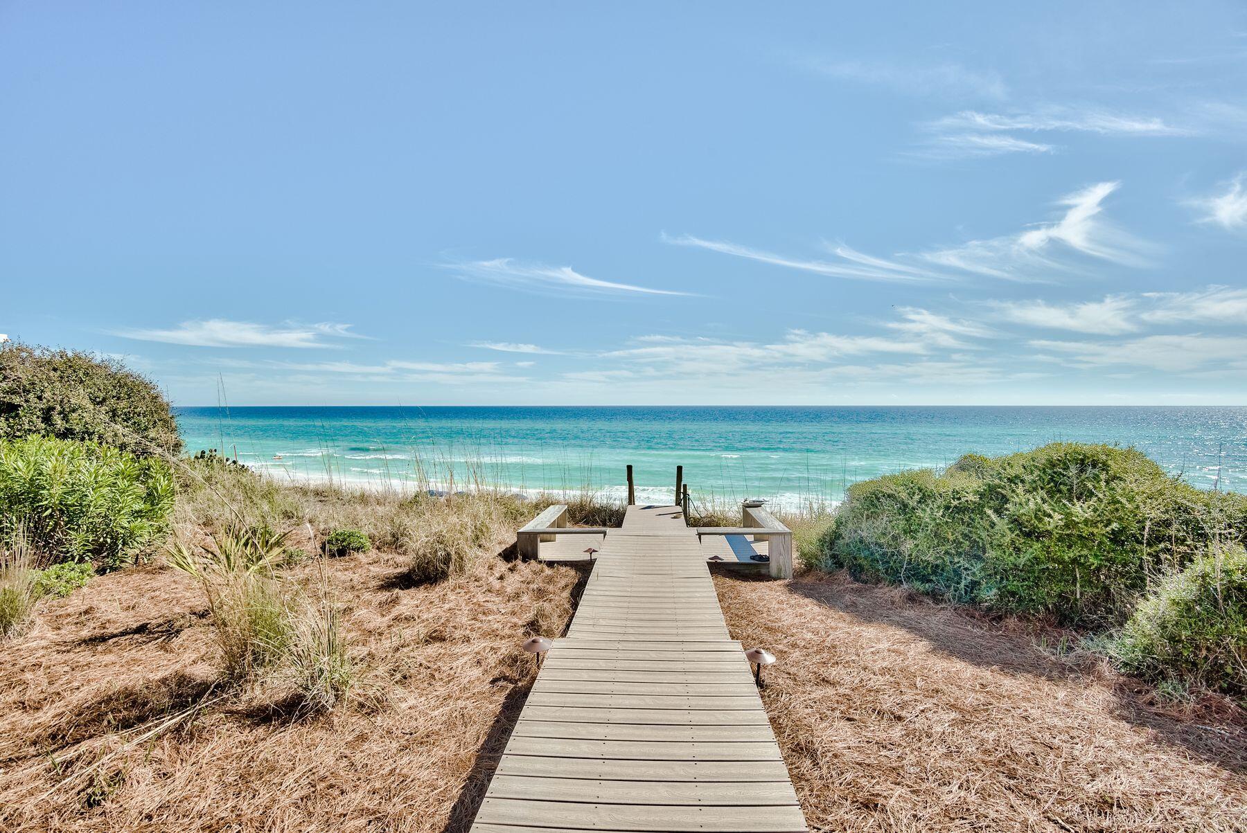 Life doesn't get much better than living on the Gulf of Mexico, and beach homes don't get much better than this estate bordering the pearl white sands and overlooking the emerald green waters. The private boardwalk begins at the back deck and ends where your toes meet the sand. This property encompasses nearly three-quarters of an acre and beckons all who appreciate superior workmanship, striking style and distinctive quality in a majestic beachfront setting. Beyond its incredible location, this elegant three-story, 6,453 sqft, five-bedroom, six-and-two-half bath home offers an abundance of exterior living space with beautifully renovated interiors.