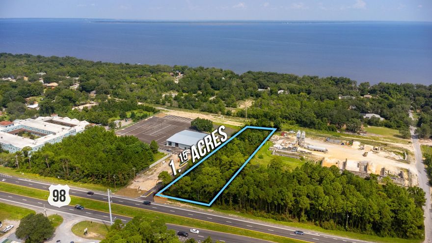 Highway Commercial Development.  Are you looking for an investment?  On this lot you could put a boat/RV storage or put, professional offices, banking, medical services, personal services, restaurants with or without drive-thru facilities, just to mention a few things you can put on this lot. This site is 1.15 acre zoned HCD (Highway Commercial Development, and offers 100' on the Highway frontage and is 503' deep. Lot is located appox. 1.7 mile to Garcon Point Bridge and 1 mile to Pensacola State College. All offers will have to go to the board for approval in a public meeting.