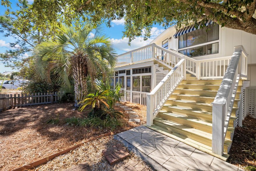 Under contract, but with a 72 hour kick out clause. Showings encouraged. This bijou beach cottage is simply brimming charm and character. Within the octagonal exterior you'll find spacious open living areas on both the first and second floors with new flooring, fresh lighting and updated bathrooms. If you're looking for open-air living, step out onto the newly built wraparound deck, which has a generously sized area for sunbathing, reading, dining and relaxing. This unusual home is not short on space inside with a remodeled family kitchen boasting quartz countertops, a pantry and stainless appliances including a French door refrigerator. There's a formal dining area and two beautiful bedrooms on this upper level enjoying panoramic views across the Old Grayton neighborhood. Two renovated