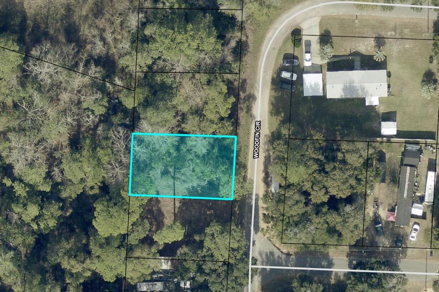 .137 ac lot Zoned R1M which allows 1 single family dwelling including a mobile home. .  RVs and multifamily units are not allowed in this zone . According to GIS map , not in a flood zone (x) , and no wetlands. See photos for all pertinent information according to the GIS. SEPTIC NEEDED. Tap in fee due. Per county:  As long as the setback requirements are met, a guest cottage can be placed on the property as well as any accessory structures such as pole barns and sheds.