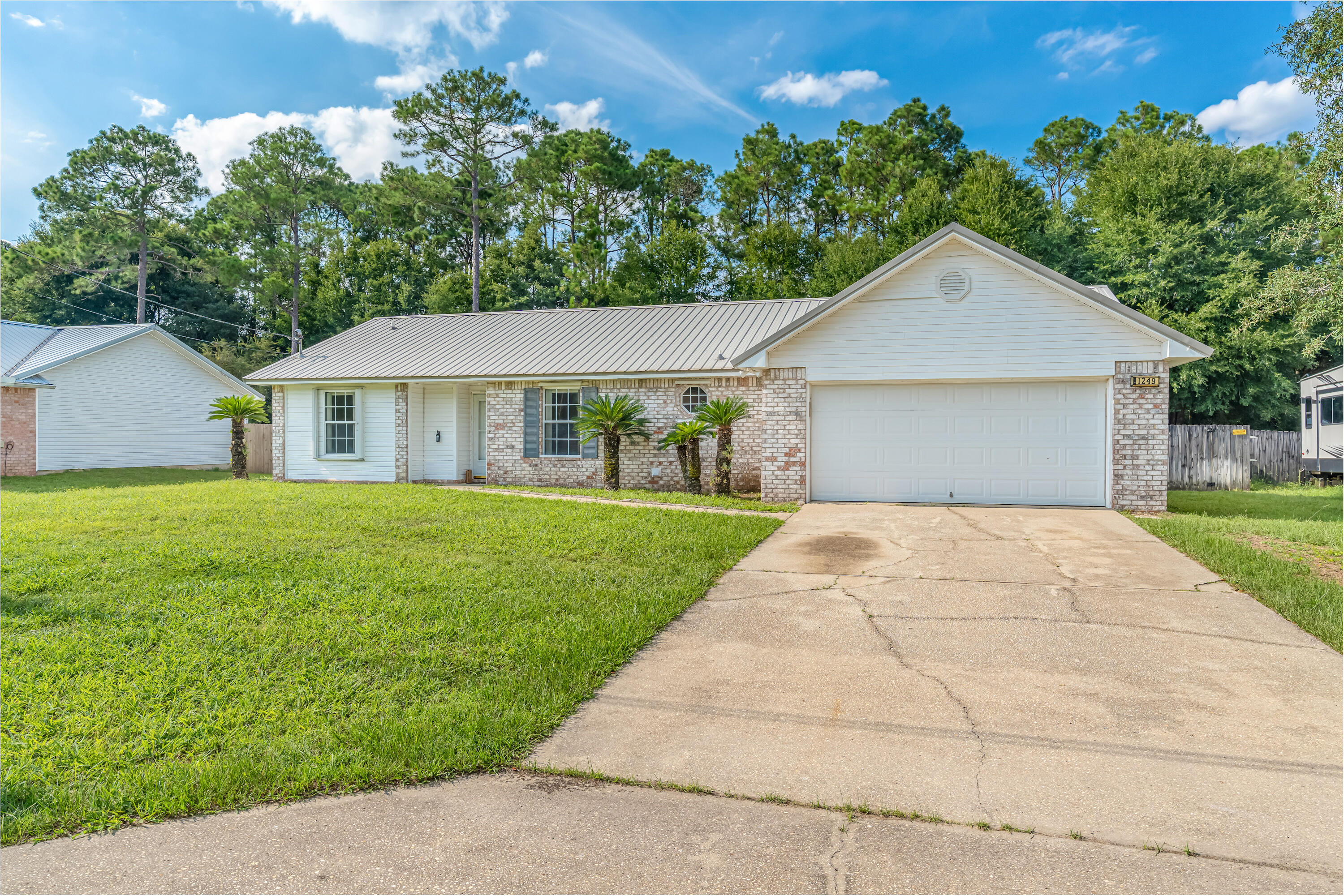 Beautiful pool home located in South Crestview. Welcome to your dream home with a pool. This well maintained 3 bedroom and 2 bathroom home offers 1606 sf of comfortable living space with a back yard built for relaxation. Enjoy your very own in-ground pool surrounded by a fully fenced backyard for privacy. The home is equipped with hurricane shutters for peace of mind, a metal roof for long lasting durability and a sprinkler system to keep your lawn looking its best. Inside, you will find a spacious layout with split bedroom floor plan. The master suite includes private bathroom with double vanities, garden tub and spacious closets. Huge laundry room off of the kitchen which includes washer and dryer with plenty of space for a large freezer. Galley Kitchen offers all appliances including refrigerator and breakfast nook! Located just minutes from the bases, shopping and schools. Don't miss your chance to own this beauty. Give me a call today.