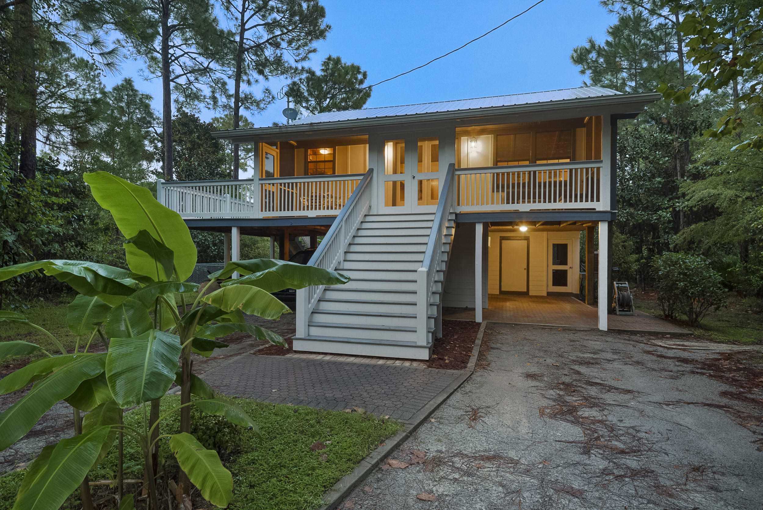 HOME IS UNDER CONTRACT AND ACCEPTING BACK UP OFFERS!New Hot-tub is included, inside one of two private screened-in areas! This truly unique home is set on a wooded lot off a private drive and is like no other in Santa Rosa Beach! You will Not find another one like it at this price! 2018 updates include a new roof, all new vertically mounted Hardie board siding on 24'' centers - including all new Hardie soffits and eves. All New decking and New stairways with beautifully crafted handmade tongue and groove rails. A small fenced-in pet area that connects to the upper covered porch. All new exterior paint. The screened in areas are finished with beautiful Handmade Cedar French doors. The home is safe - built high on pilings. Dual carports un ...designed to back a hitched boat and truck directly under the home after a day on the water. Small workshop with built-in work bench. Two bedrooms, two full baths upstairs with vaulted ceilings in the main living area. Third bedroom downstairs is currently used as a guest room, but could easily be converted into a theater room or a small business workshop or office with plenty of power outlets. Only 1/2 mile to public boat launch and four miles from the beach. It has been well loved by the current owner and HVAC and all kitchen stainless appliances were replaced a little over five years ago. Washer and dryer are also included!