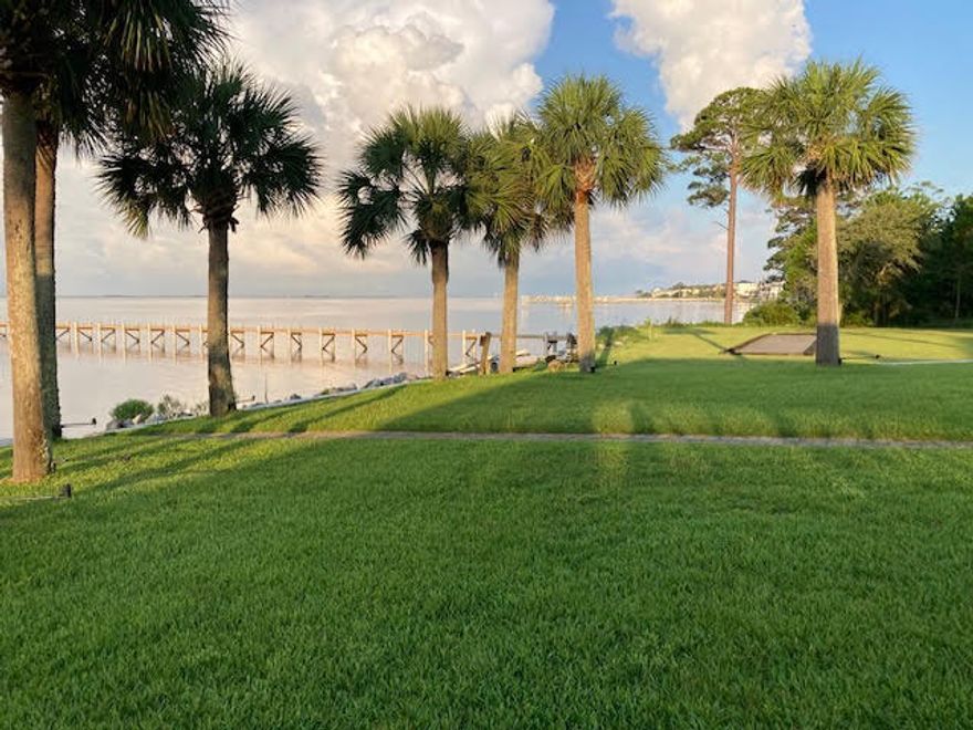 WATERFRONT with UNOBSTRUCTED VIEWS of the SANTA ROSA SOUND and barrier island with PIER (approximately 250 foot long) and BOAT LIFTS (capacities 20,000+ and 5,000 pound). Electric and Water on Pier with Entertainment Area, Swing, Flow thru Decking.  Boat access  TO PENSACOLA BEACH on the WEST and CRAB ISLAND/DESTIN on the East.  NEED A Home Office, Studio, Home Schooling Area with separate entrance & plumbing available...YOU HAVE IT HERE.Large LIVING ROOM and DINING COMBO, WATERVIEWS,  & Electric         Fireplace.  4+ Split bedroom floor plan with multiple entrances. GUEST SUITE with walk in shower, separate entrance & doggie door. MAN CAVE or WORKSHOP  area in  climate control Garage outfitted with Deep Sink w/ Hot/Cold Water , cabinetry, Hanging storage for hurricane Shutters.    LOW MAINTENANCE All BRICK with METAL ROOF, gutters, exterior shower, patio, New Electric Fireplace, Fresh Paint, Knock down ceiling texture, Kitchen has new refrigerator, and stove, new refrigerator in the studio. New garage heating and cooling unit.  Tile & ceiling fans throughout.  TANKLESS Water Heater on Gas. Irrigation system, and private well, patio on the rear with fencing. 
SOUTHWEST GUEST SUITE  with water view, private bath, walk in shower, handicap features and PRIVATE ENTRANCE. NORTHWEST CORNER Guest Room, guest bath. Master is located on the SOUTHEAST Corner with cultured marble jetted garden tub, separate shower, double vanity and WATER VIEW. Fourth bedroom  located off of the living room.  The Fifth bedroom/Home Office/Studio/Multipurpose room has a PRIVATE ENTRANCE,  Daiken Heating and Air Unit, Storage Cabinets, closet, plumbing for potential sink.
     Two car garage with opener is a dream for any home owner who wants organization with lots of storage cabinets, 220 Volt, climate control, refinished floor, hurricane coverage stored up and out of the way, deep sink with hot and cold water.  Attic duct work has been replaced.
     The kitchen has granite counter tops, pantry with pull out shelves, wine glass rack, microwave, new fridge, and stove, Lights under the breakfast bar. Kitchen offers a water view extending into the dining area, room for a living room and oversized china cabinet and dining table,  with SPECTACULAR WATER VIEWS.   TERMITE BOND IS TRANSFERABLE, Home inspection, Survey and Elevation Certificate have been accomplished and available for your viewing on site.   Timed outside lighting accenting the palm trees. EASY TO SHOW and Quick occupancy. Call listing agent for viewing today. Claim your piece of PARADISE  ON THE WATER with UNOBSTRUCTED VIEWS OF the BARRIER ISLAND FROM NAVARRE to PENSACOLA. Jump in your for an evening at AWANAS on Navarre Beach or Dinner on Pensacola Beach both in walking distance of the GULF from boat docks.  YOU GOTTA LOVE THE LOCATION and ENTERTAINMENT OPTIONS IN THIS HOUSE.  Buy a lot in Holley by the Sea and utilize the Recreational Center year round.