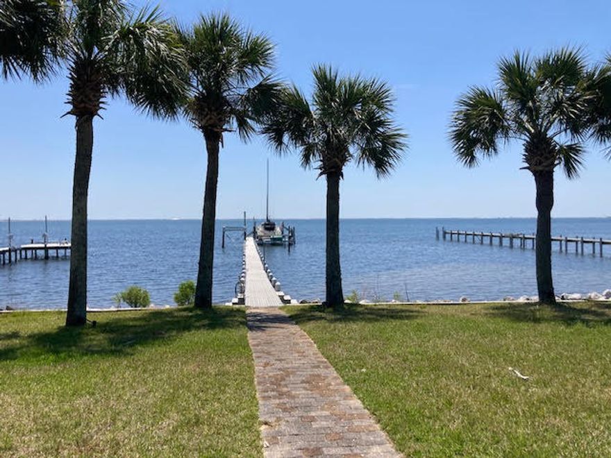 WATERFRONT HOME WITH PIER, BOAT LIFTS and GORGEOUS VIEWS OF THE INTERCOASTAL WATERWAY.Survey and Elevation Certificate have been completed. PIER has flow thru decking, water, electric,  20,000+ pound boat lift, 5,000 pound boat lift, Light Pole, entertainment deck, swing and great fishing. Waterfront is 71 feet with retaining wall. ALL BRICK HOME with METAL ROOF and GUTTERING, outside accent LIGHTING with AUTO features.  Mature landscaping, Outdoor Shower, CENTRAL HEATING and AIR throughout (including window unit in garage, DAIKEN ductless unit in the large multipurpose/possible fifth bedroom),TILED THROUGHOUT, Newly Painted, WINDOW TREATMENTS throughout and Knock down ceilings.  New Refrigerators (2), New Stove, Pull out shelving, Granite Counter Tops, New Electric Fireplace.  Attic Duct work replaced, ON DEMAND WATER HEATER. Cultured Marble Master bath  with jetted tub, separate shower, double sink vanity. 
 Kitchen has tiled back splashes, garbage disposal, wine glass rack, microwave, under the bar lighting and spice rack with pull out pantry shelving,   
Possible Second Master bedroom on the rear  is equipped with handicap grab bars and  walk in shower and exterior door to the patio.  
NO HOA (park your boat/trailer/RV in the driveway. 
Home is under a Termite Bond 
This equipment is as is.  Call today for an appointment to view.  Please provide letter of prequalification prior to showing.